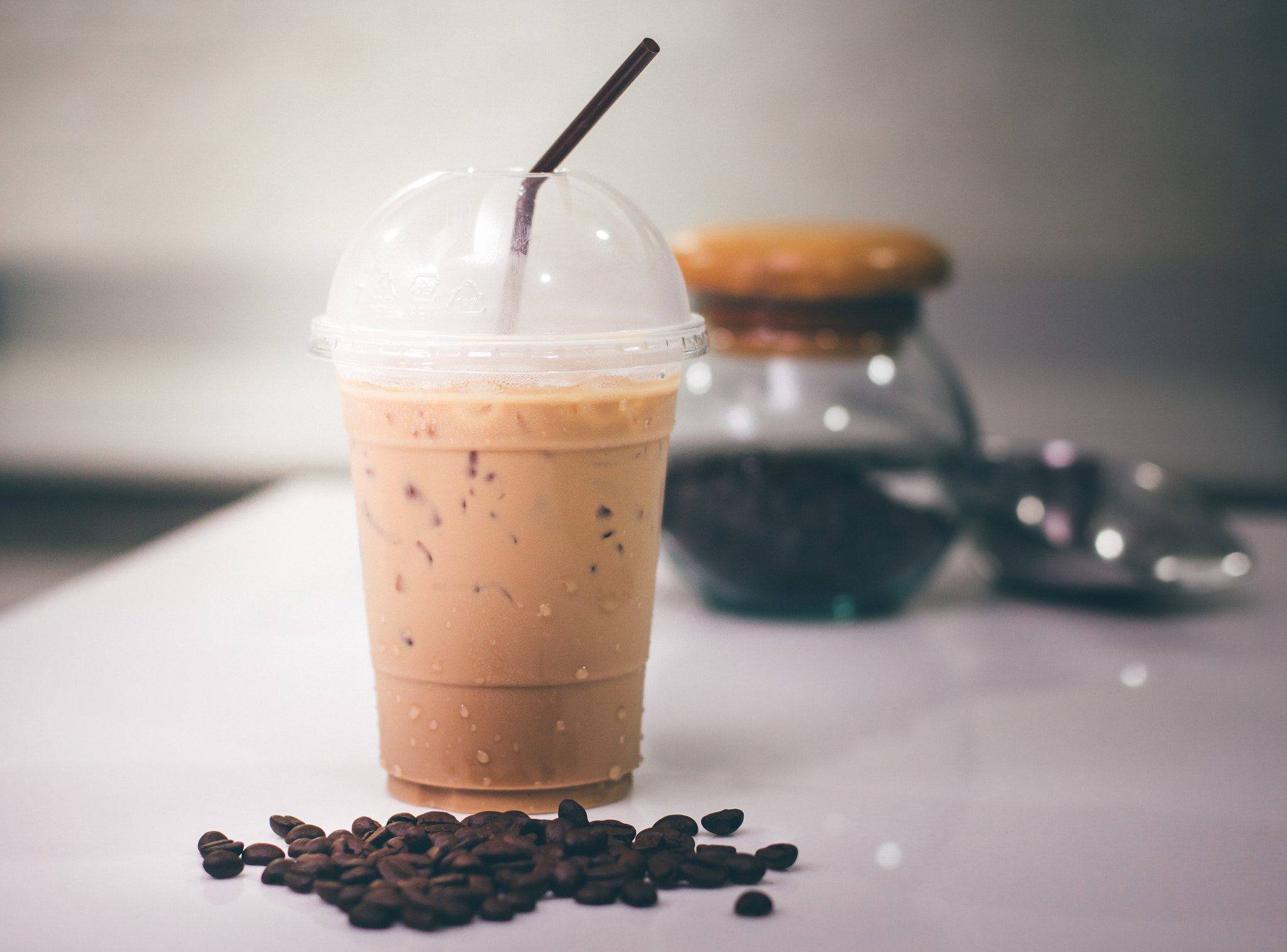 Canon EOS 60D sample photo. Ice coffee  with coffee beans and jar on modern kitchen table. photography