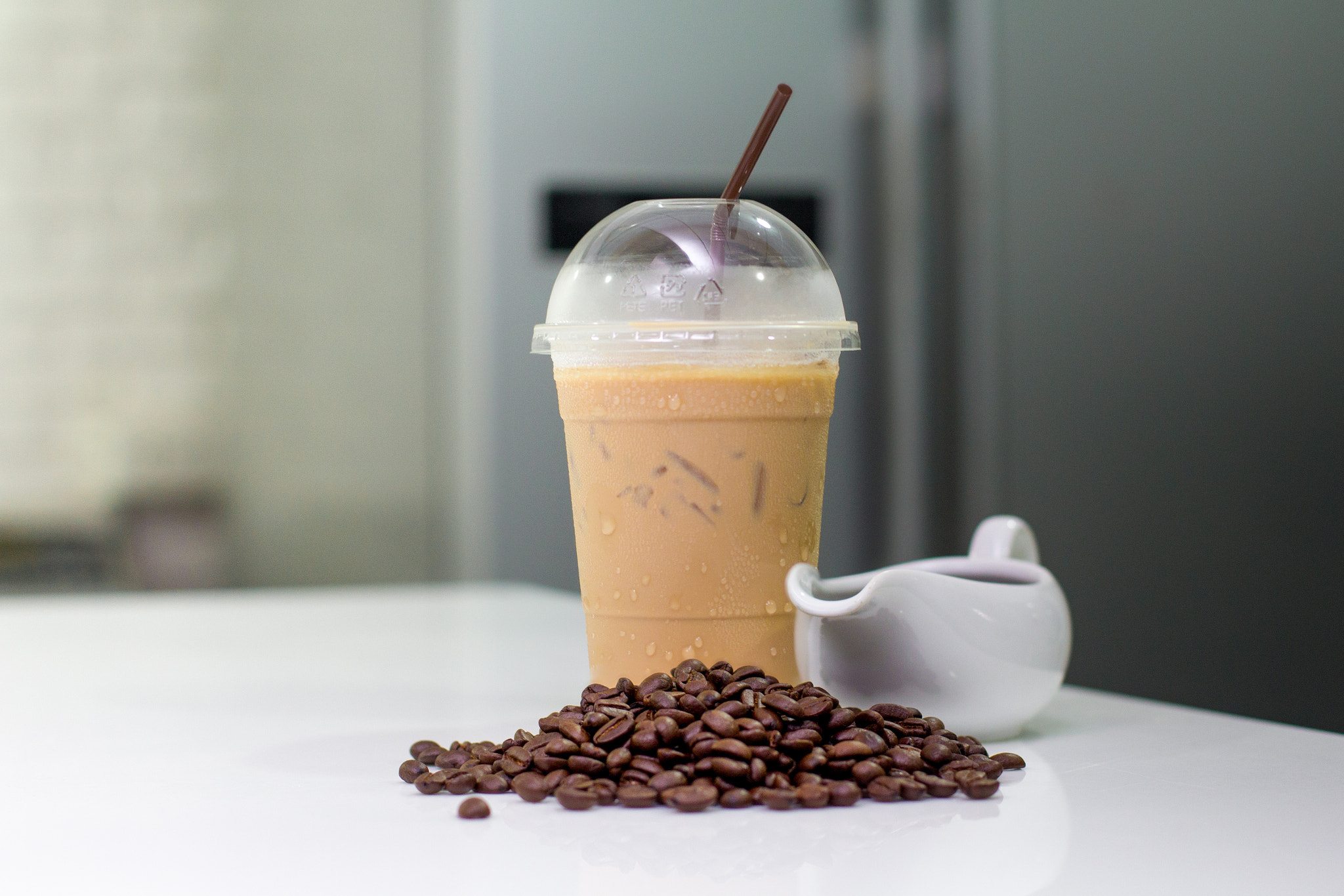 Canon EOS 60D + Canon EF 50mm F1.4 USM sample photo. Ice coffee  with coffee beans and jar on modern kitchen table. photography