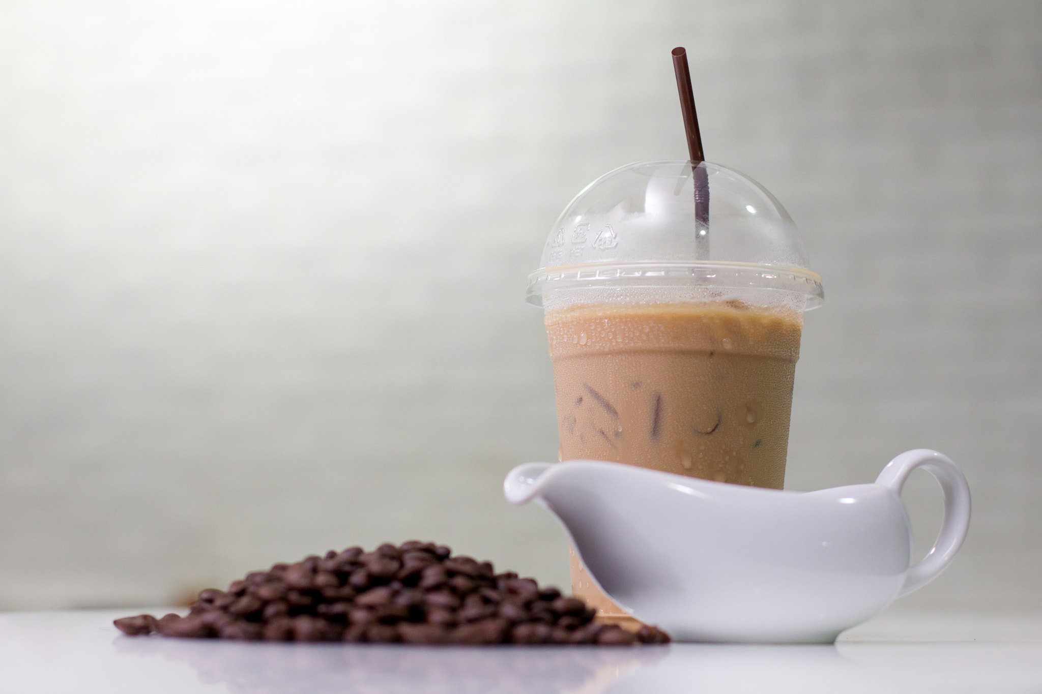 Canon EOS 60D + Canon EF 50mm F1.4 USM sample photo. Ice coffee  with coffee beans and jar on modern kitchen table. photography