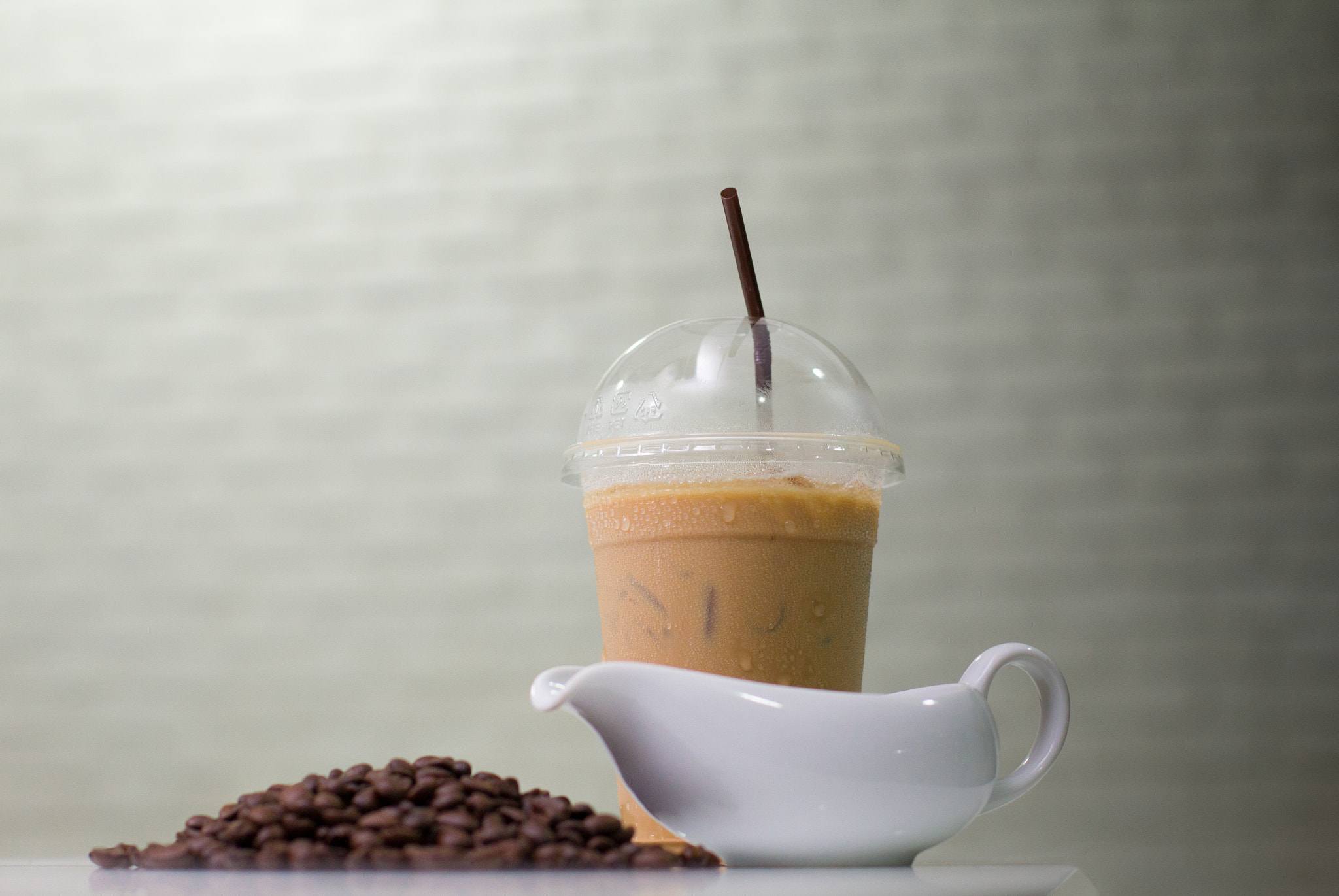 Canon EOS 60D + Canon EF 50mm F1.4 USM sample photo. Ice coffee  with coffee beans and jar on modern kitchen table. photography
