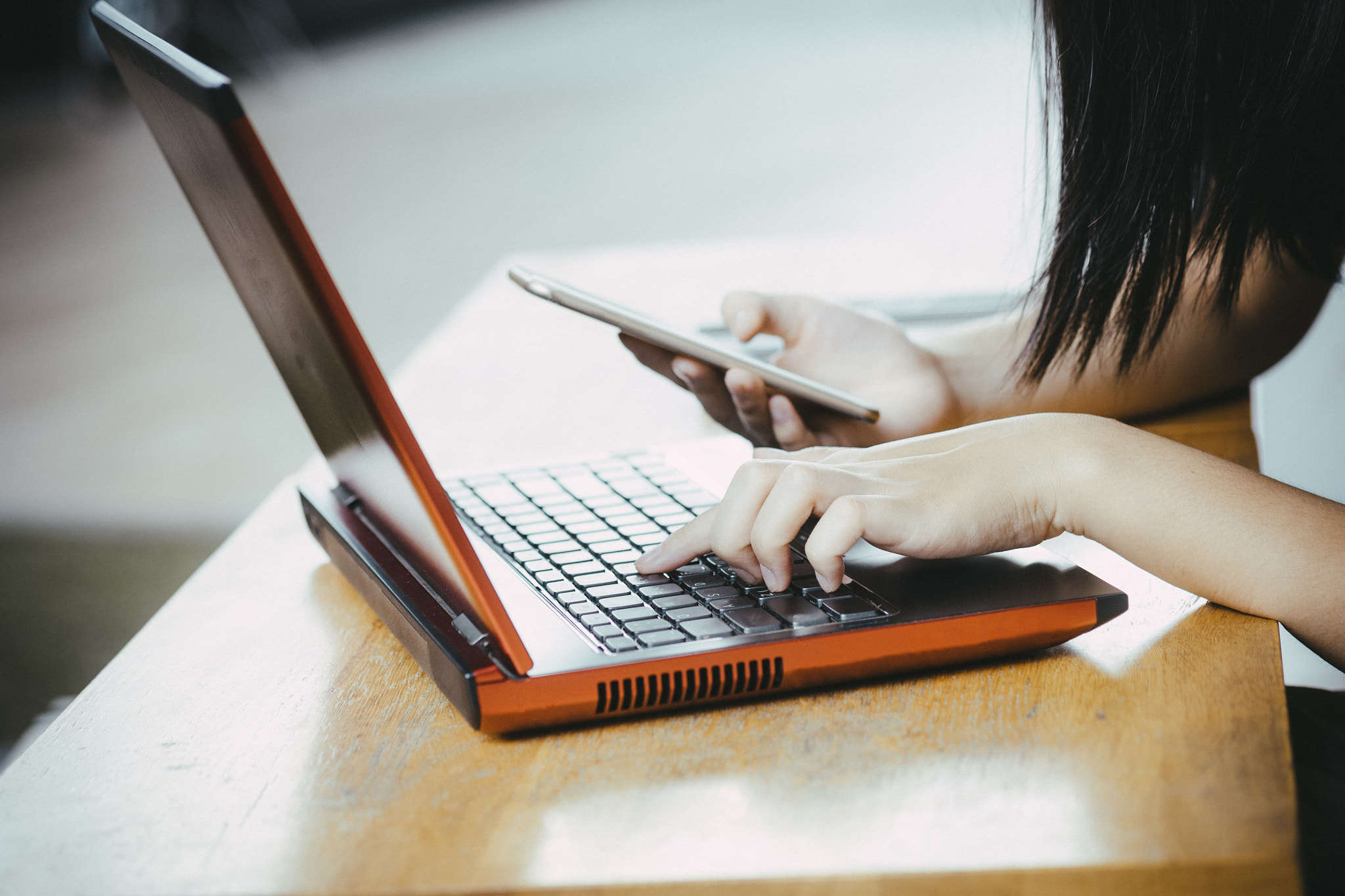 Fujifilm XF 60mm F2.4 R Macro sample photo. Young hipster woman using smartphone and laptop, online concept photography
