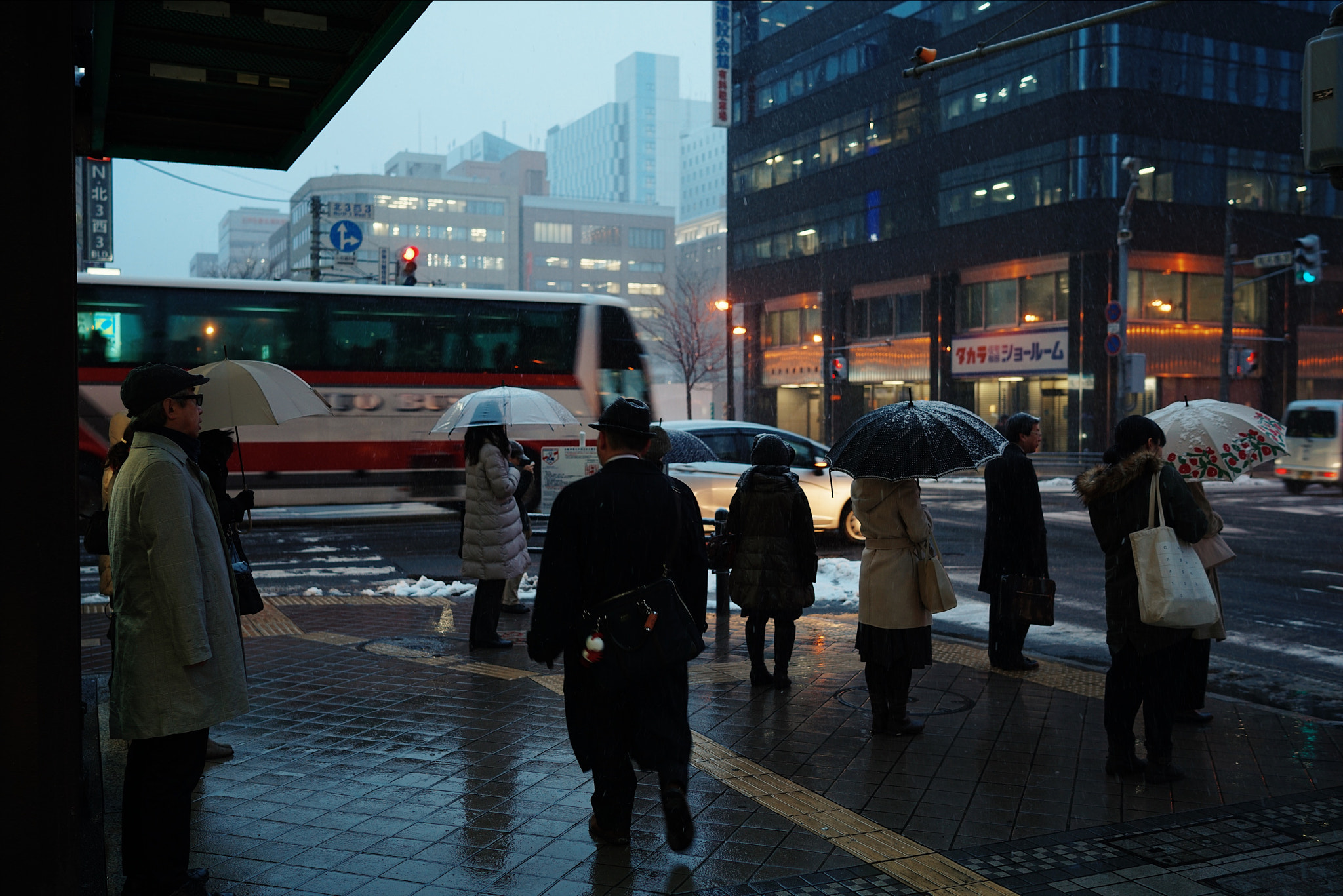 Sony Distagon T* FE 35mm F1.4 ZA sample photo. Street in sapporo japan. it was snowing a little a ... photography
