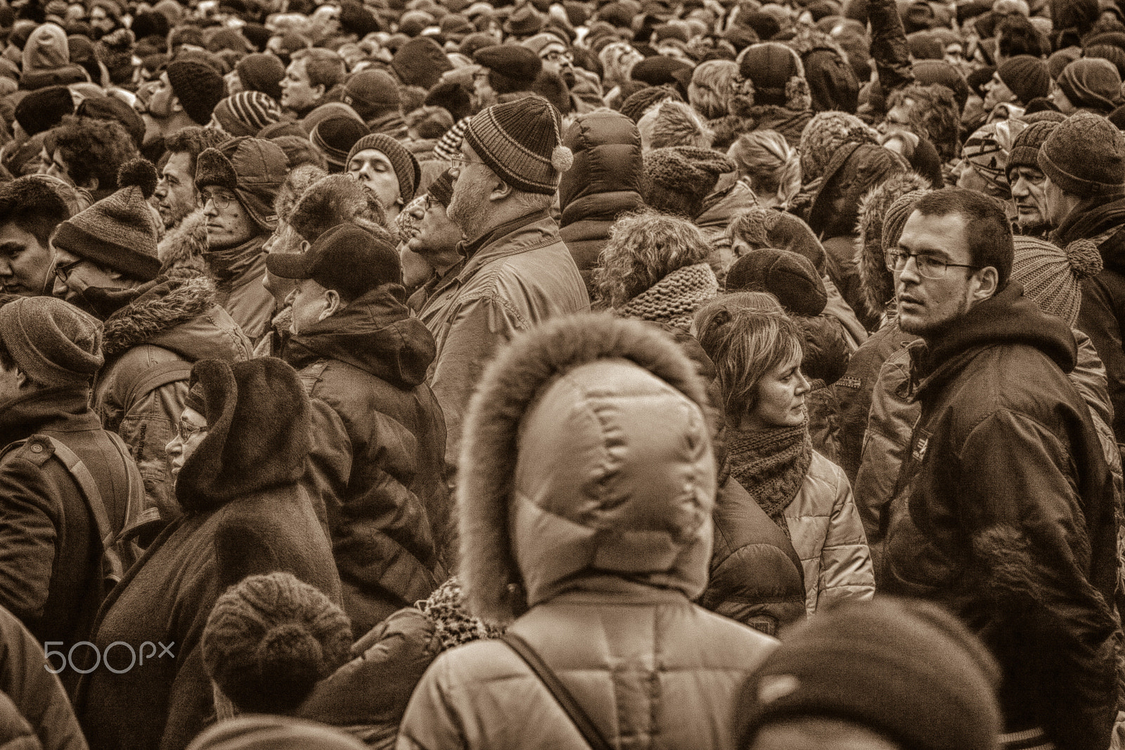 Canon EOS 5D + Canon EF 28-135mm F3.5-5.6 IS USM sample photo. Sad people in crowd photography