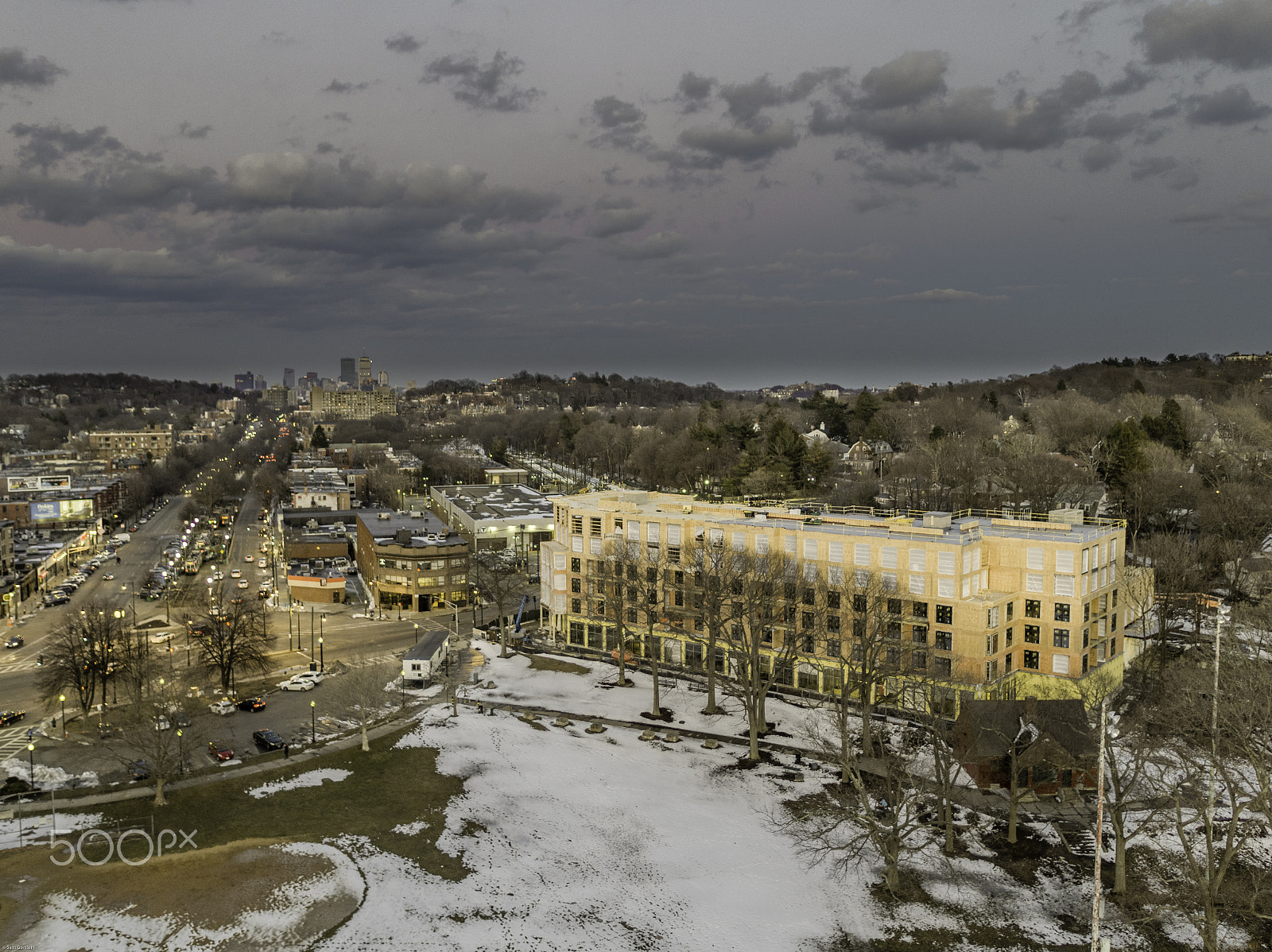 DJI MFT 15mm F1.7 ASPH sample photo. Construction at cleveland circle with boston skyline in distance photography