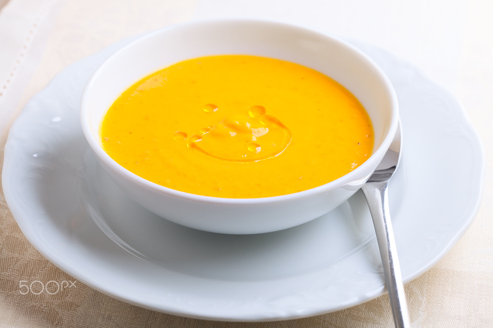 Canon EOS 5D Mark II sample photo. Pumpkin soup with cream served on a table photography