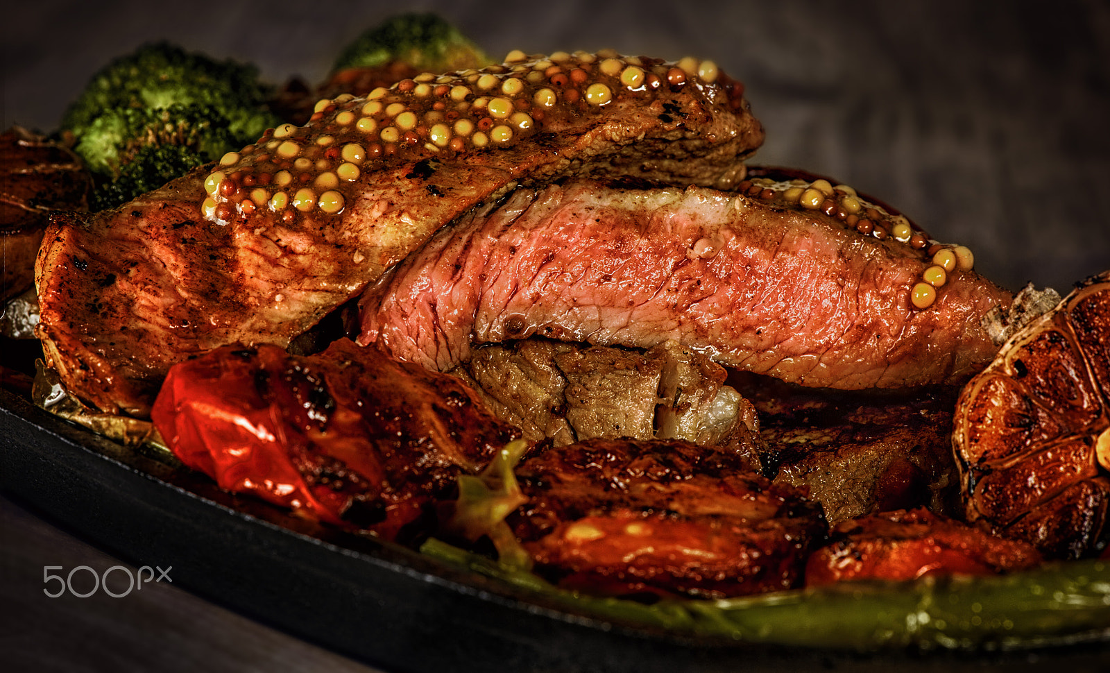 Nikon AF-S Micro-Nikkor 105mm F2.8G IF-ED VR sample photo. Steak rare with the blood, pepper, garlic, tomatoes, broccoli, roasted on the grill, in a frying... photography