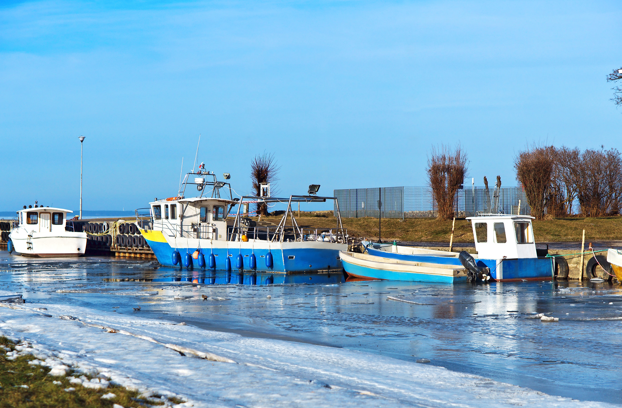 Sony Alpha NEX-3N + E 50mm F1.8 OSS sample photo. Fishing, dock, ice, boat, vessel, ship, waterfront photography
