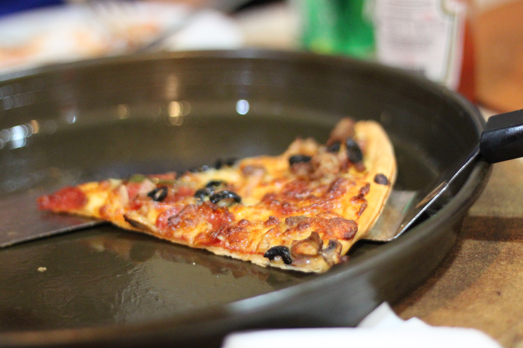 Canon EOS 500D (EOS Rebel T1i / EOS Kiss X3) sample photo. Pizza slice photography