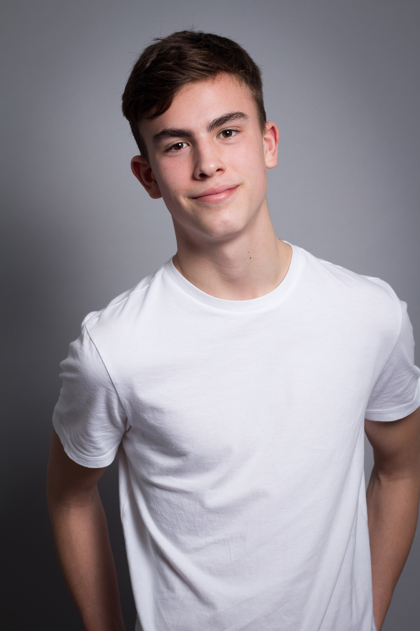 Canon EOS 650D (EOS Rebel T4i / EOS Kiss X6i) + Canon EF 50mm F1.8 II sample photo. Finley in white t-shirt photography