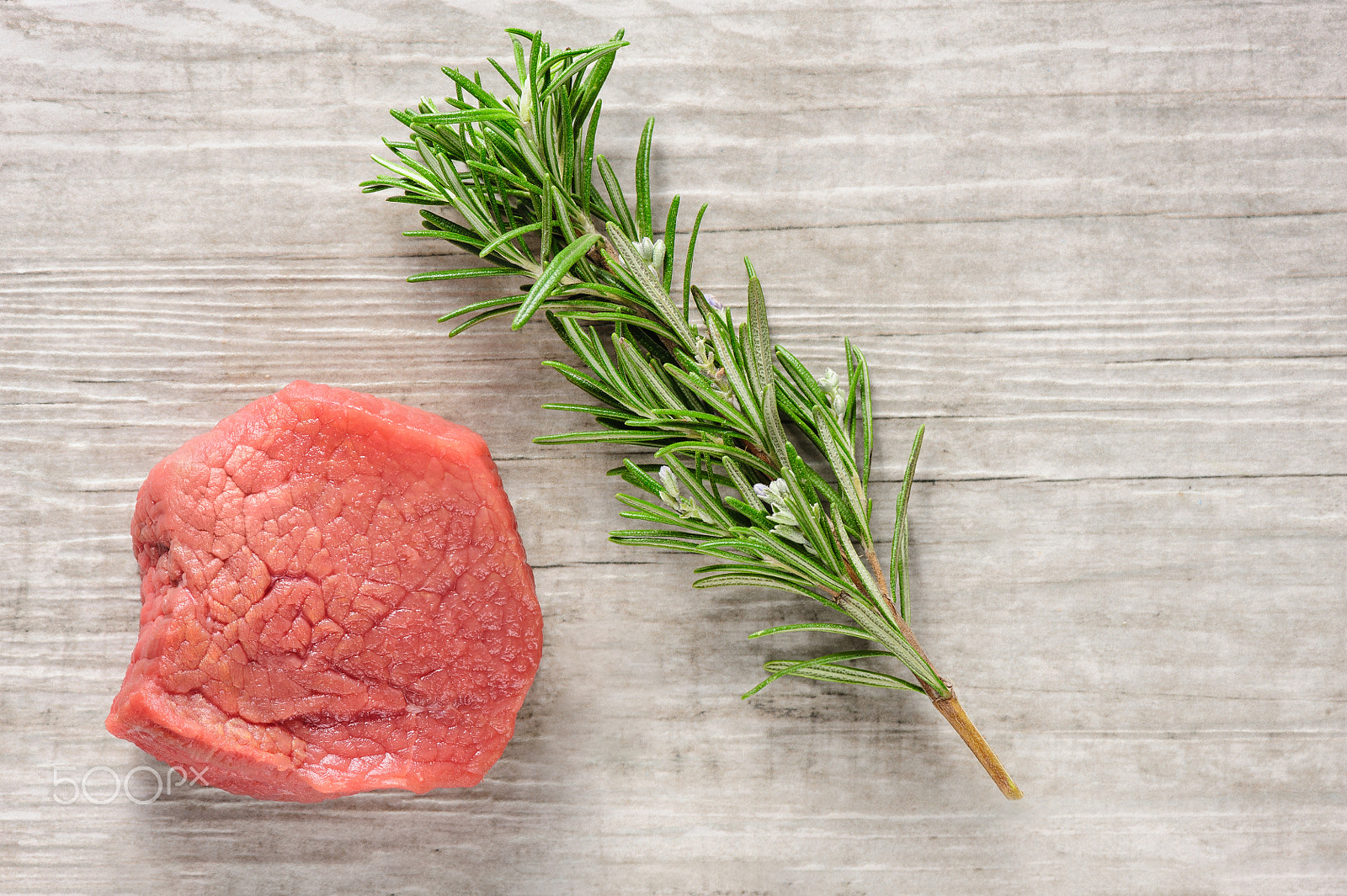 Nikon D700 + Nikon AF-S Micro-Nikkor 105mm F2.8G IF-ED VR sample photo. Beef meat and rosemary on white wood or stone background photography