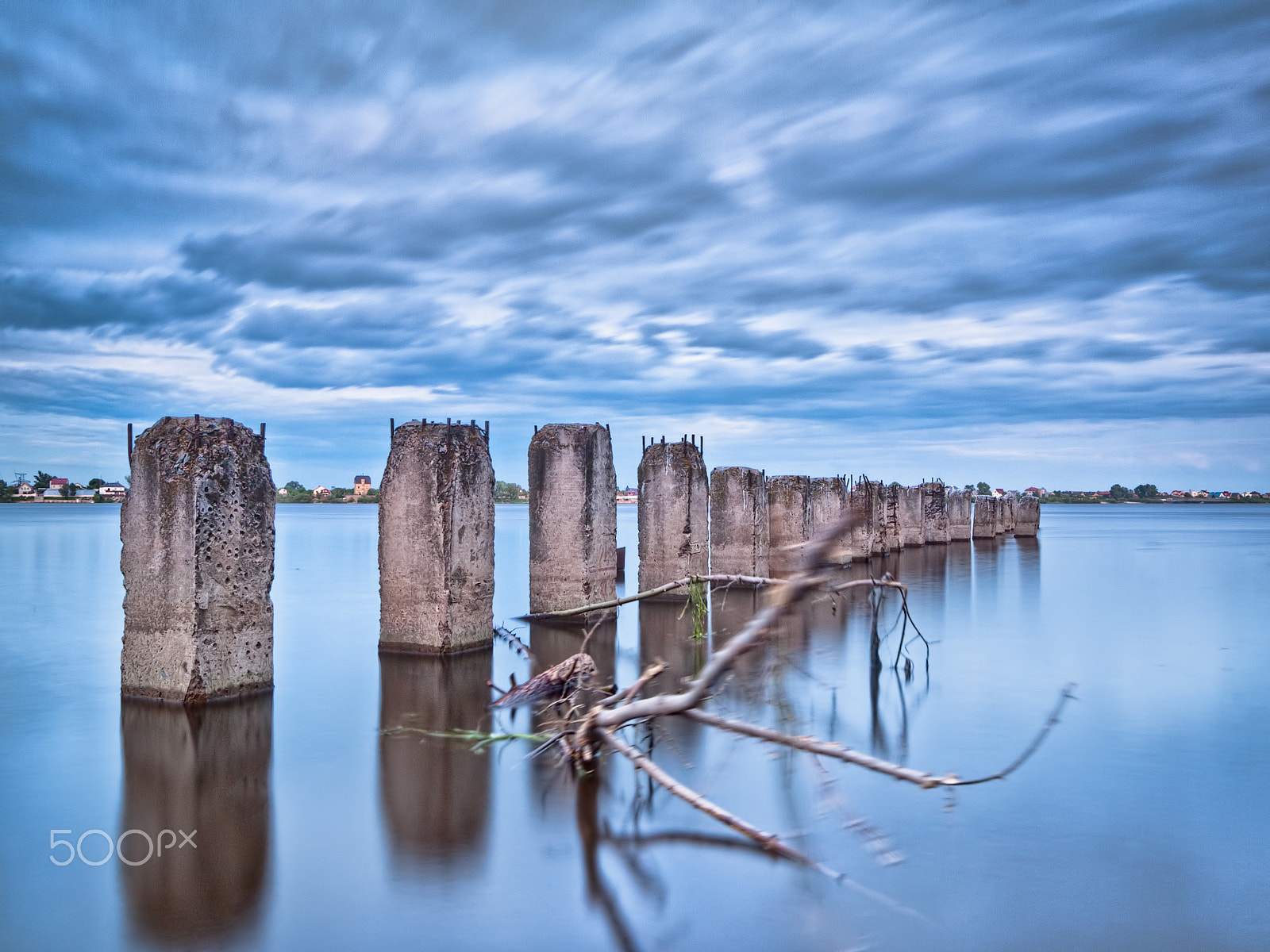 Olympus E-520 (EVOLT E-520) sample photo. River and pillars in the water photography