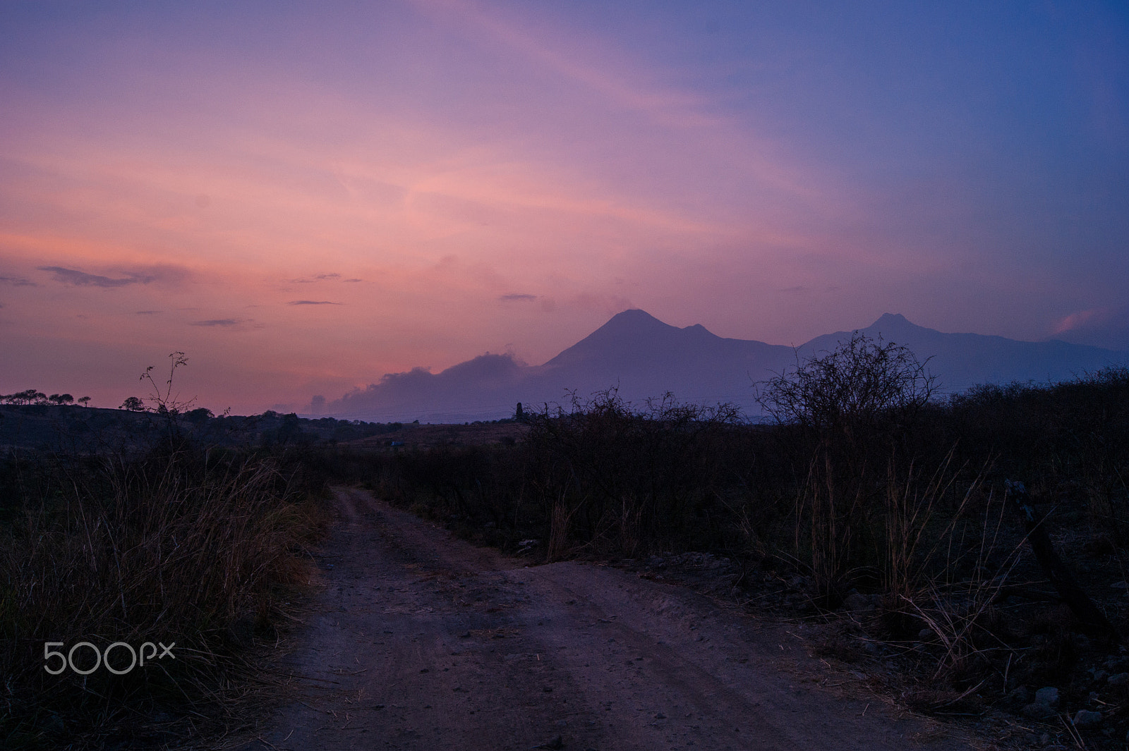 Sony Alpha DSLR-A380 + Sony DT 18-55mm F3.5-5.6 SAM sample photo. Volcano and road at sunset photography