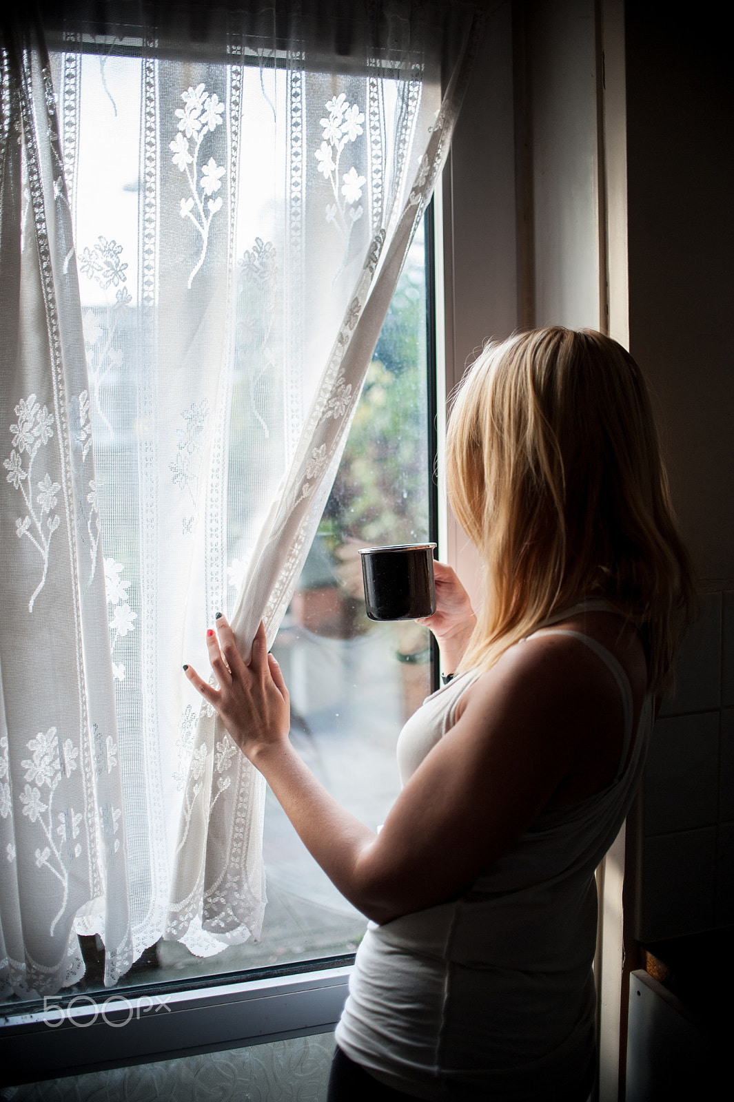 Nikon D700 sample photo. Woman holding a cup looking trough window photography