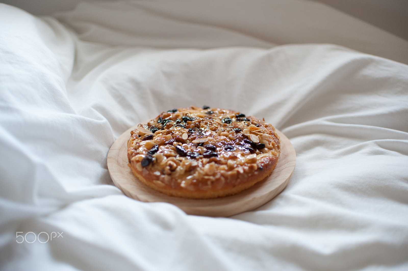 Nikon D700 sample photo. Nuts cake on white bed photography