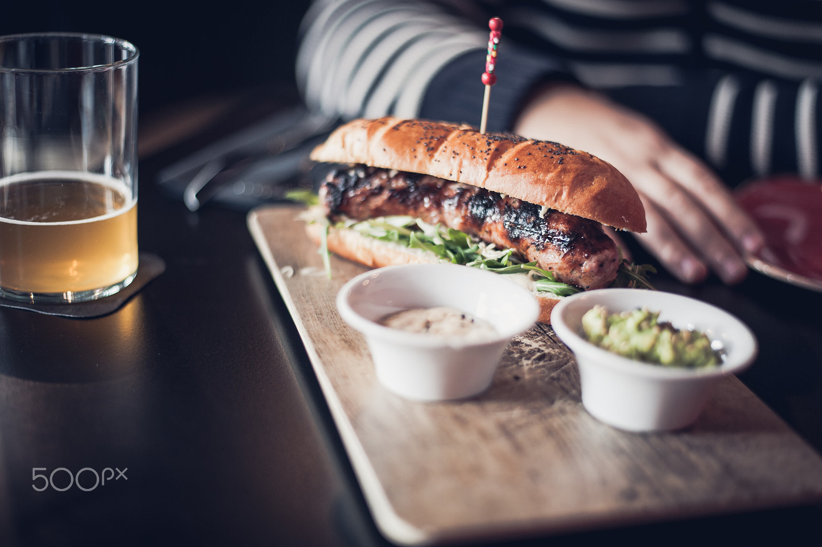 Nikon D700 + Nikon AF-S Nikkor 50mm F1.8G sample photo. Hot dog at the restaurant with friends photography