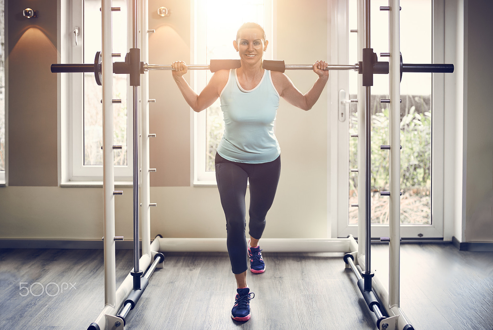 Sigma 35mm F1.4 DG HSM Art sample photo. Woman doing barbell lunge exercise photography