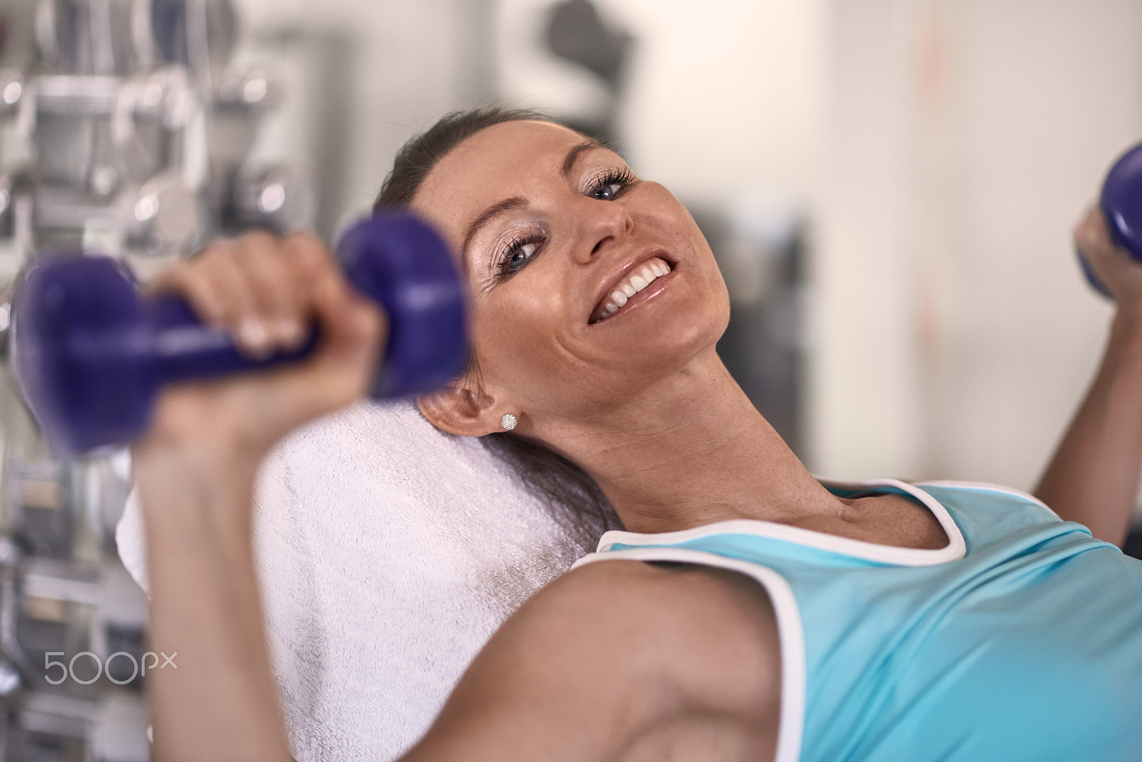 Nikon AF-S Nikkor 85mm F1.8G sample photo. Attractive middle-aged woman working out in a gym photography