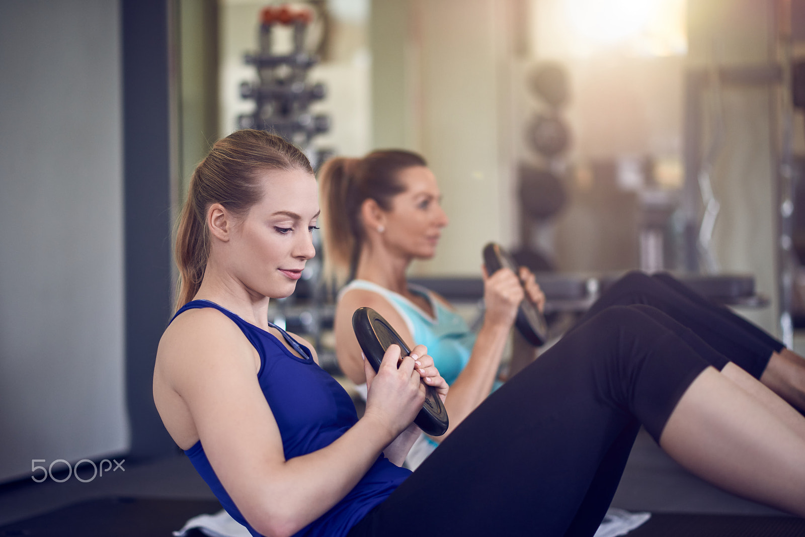 Nikon AF-S Nikkor 85mm F1.8G sample photo. Women doing abdominal muscle exercises photography