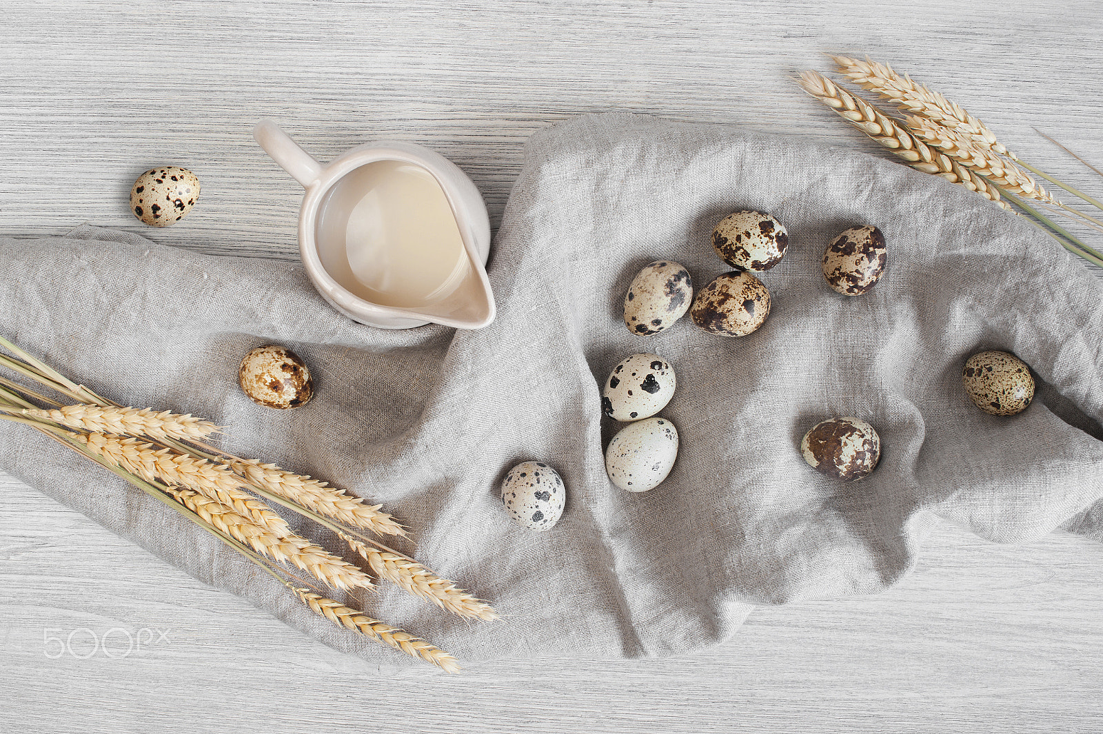 Nikon D700 sample photo. Jag of milk, quail eggs and wheat on the linen napkin photography