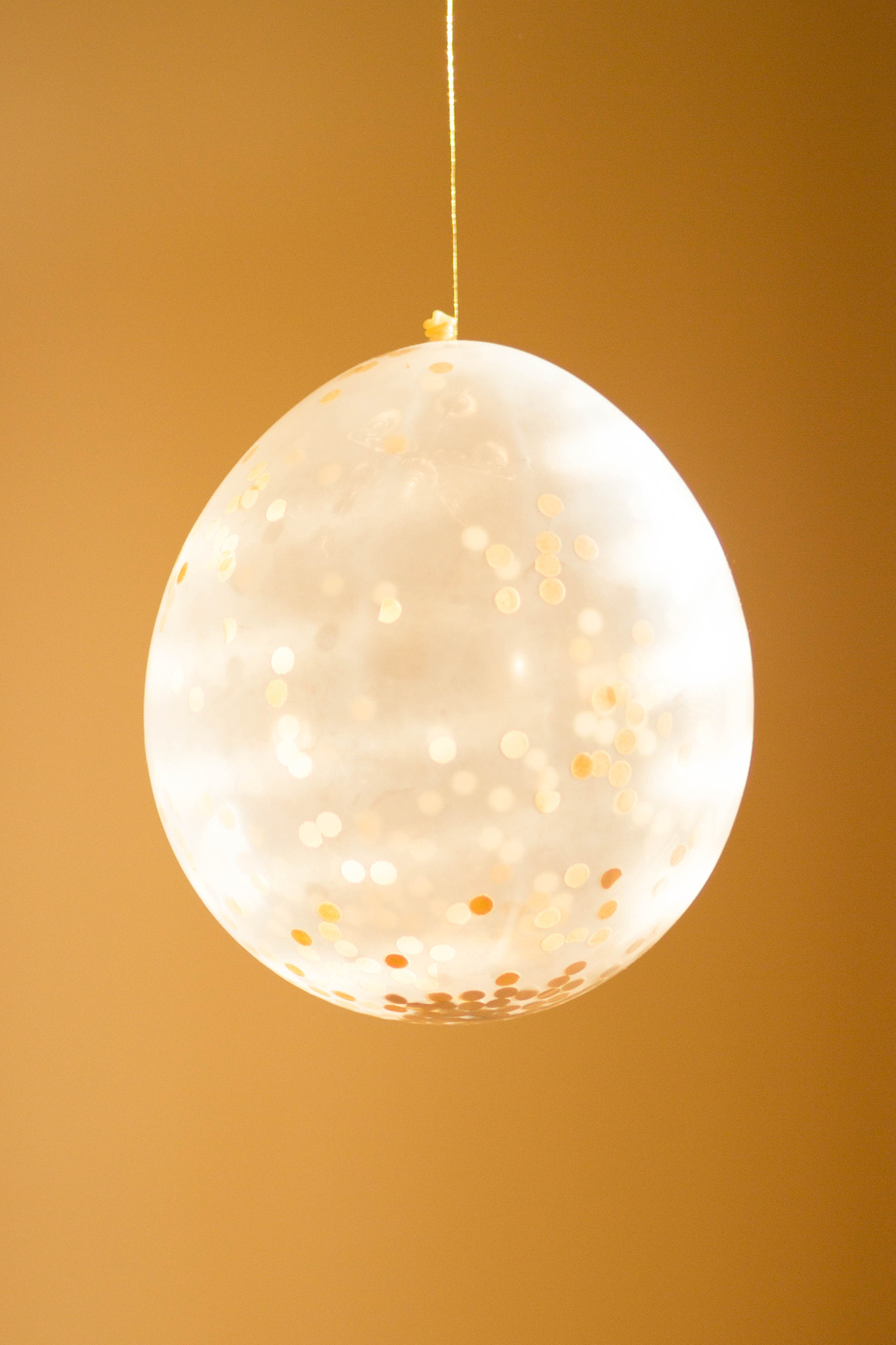 Canon EF 85mm F1.8 USM sample photo. Confetti balloons gold tones photography