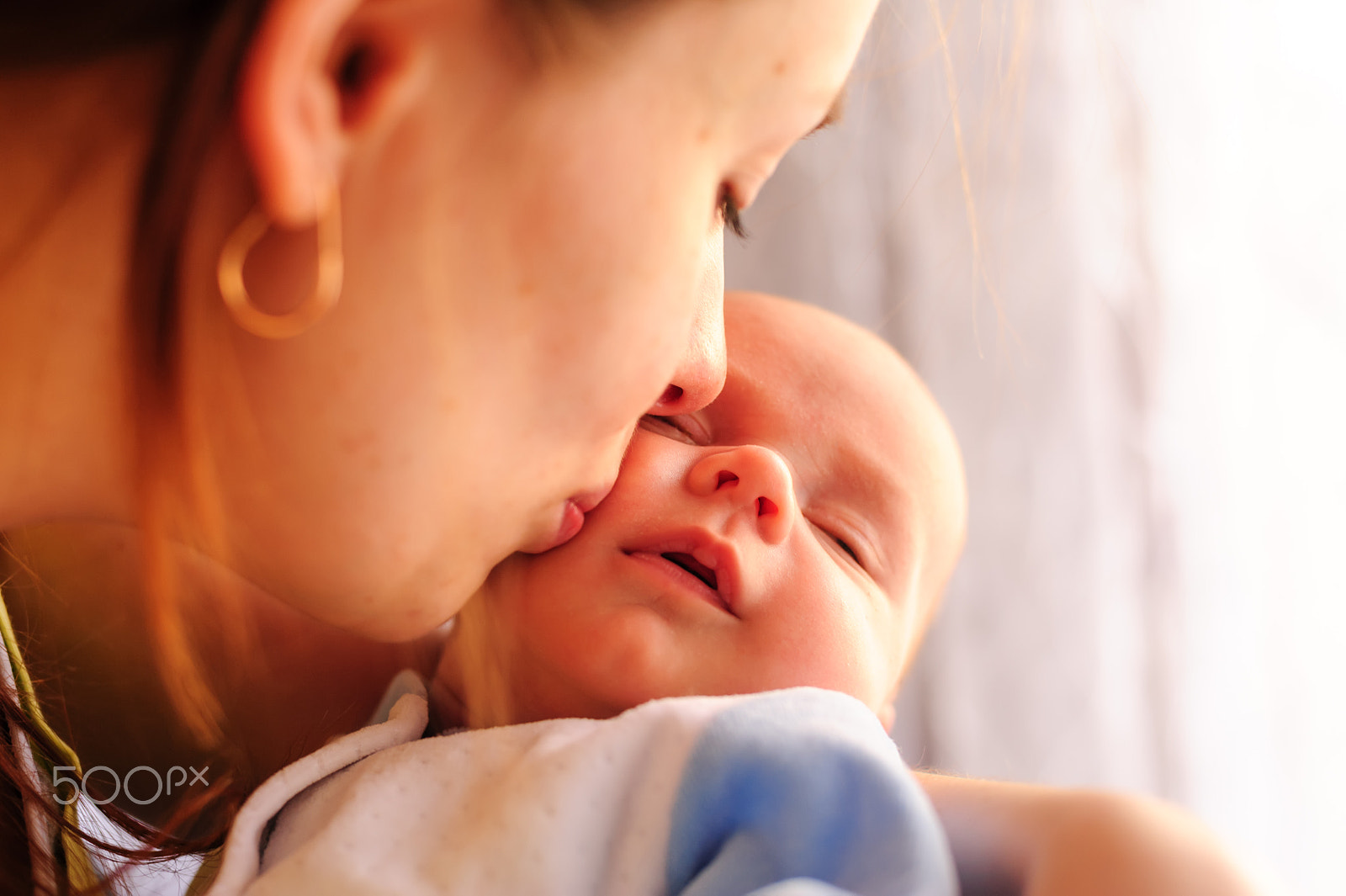 Nikon D700 + Nikon AF Nikkor 50mm F1.4D sample photo. Young mother kissing her little newborn baby photography