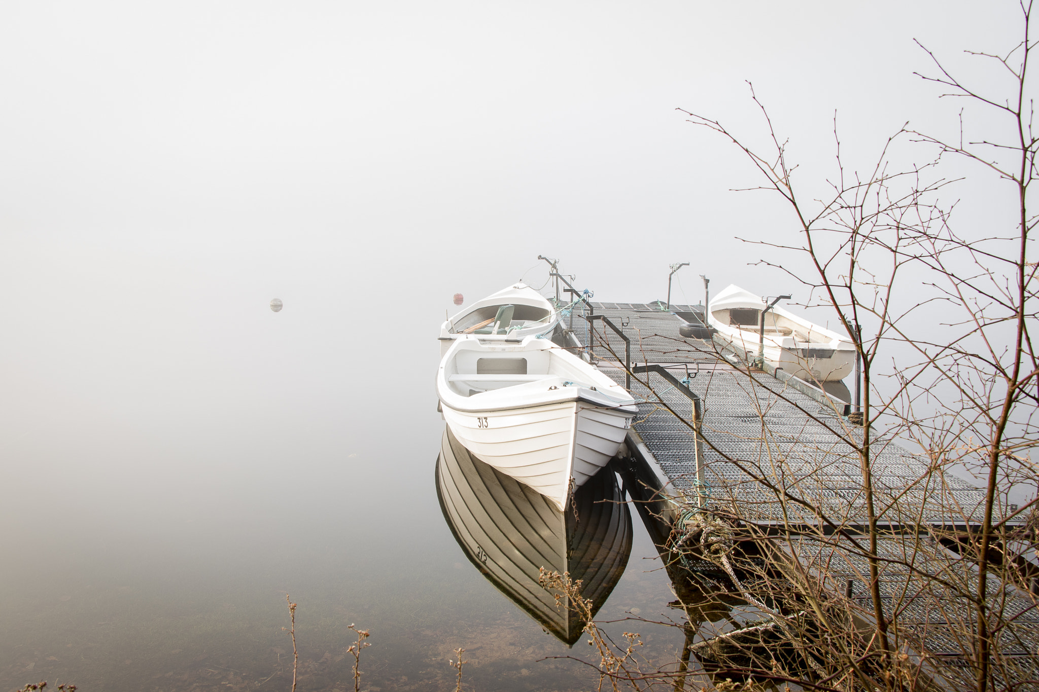 Canon EOS 70D + Canon EF-S 18-135mm F3.5-5.6 IS USM sample photo. Boats in the mist photography