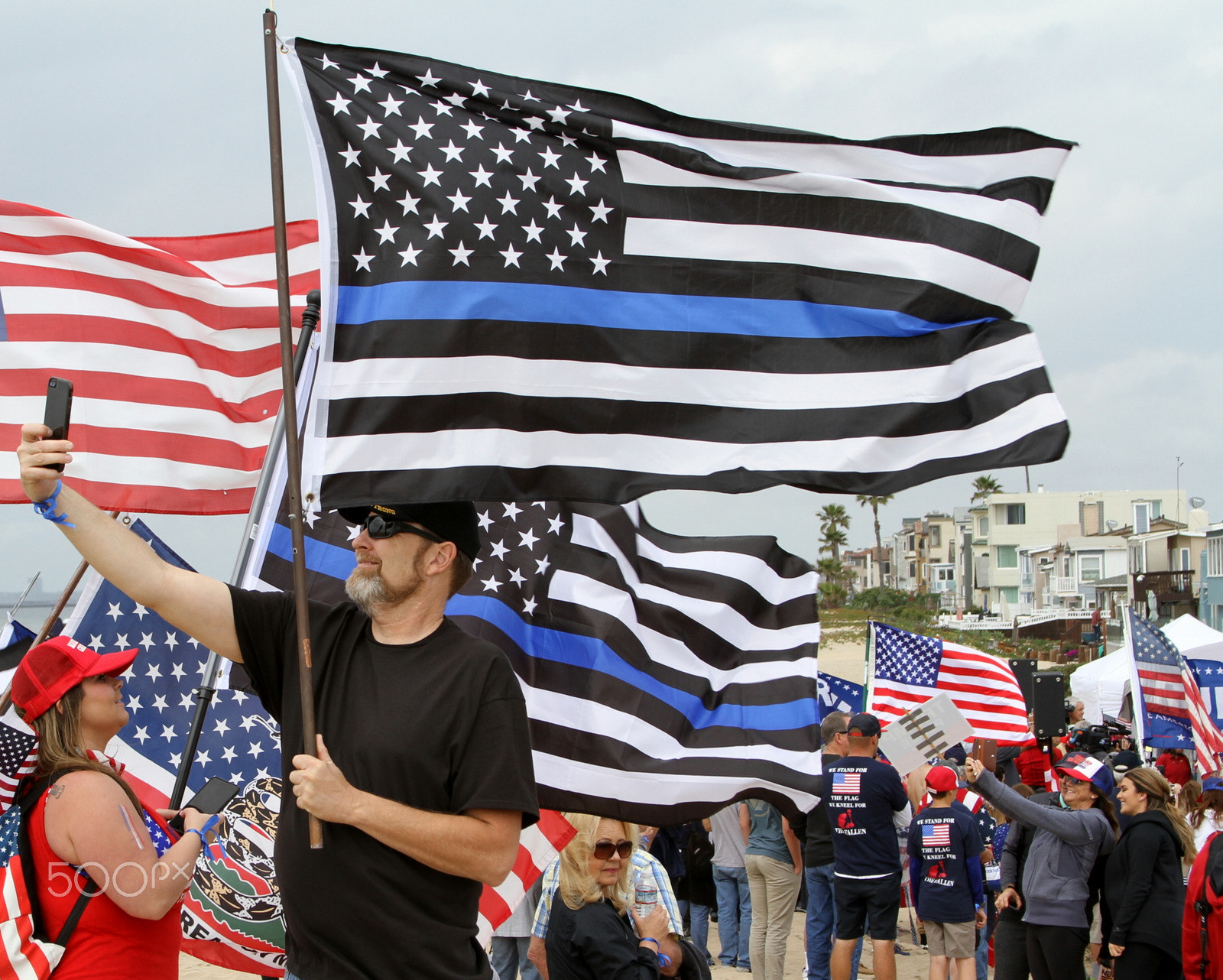 Canon EOS 7D + Canon EF 28-135mm F3.5-5.6 IS USM sample photo. Trump rally bolsa chica beach photography