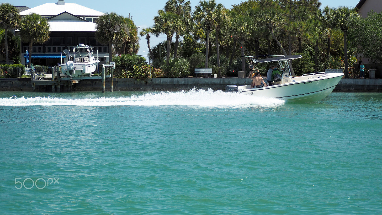 Olympus OM-D E-M5 II sample photo. Boat leaving wake photography