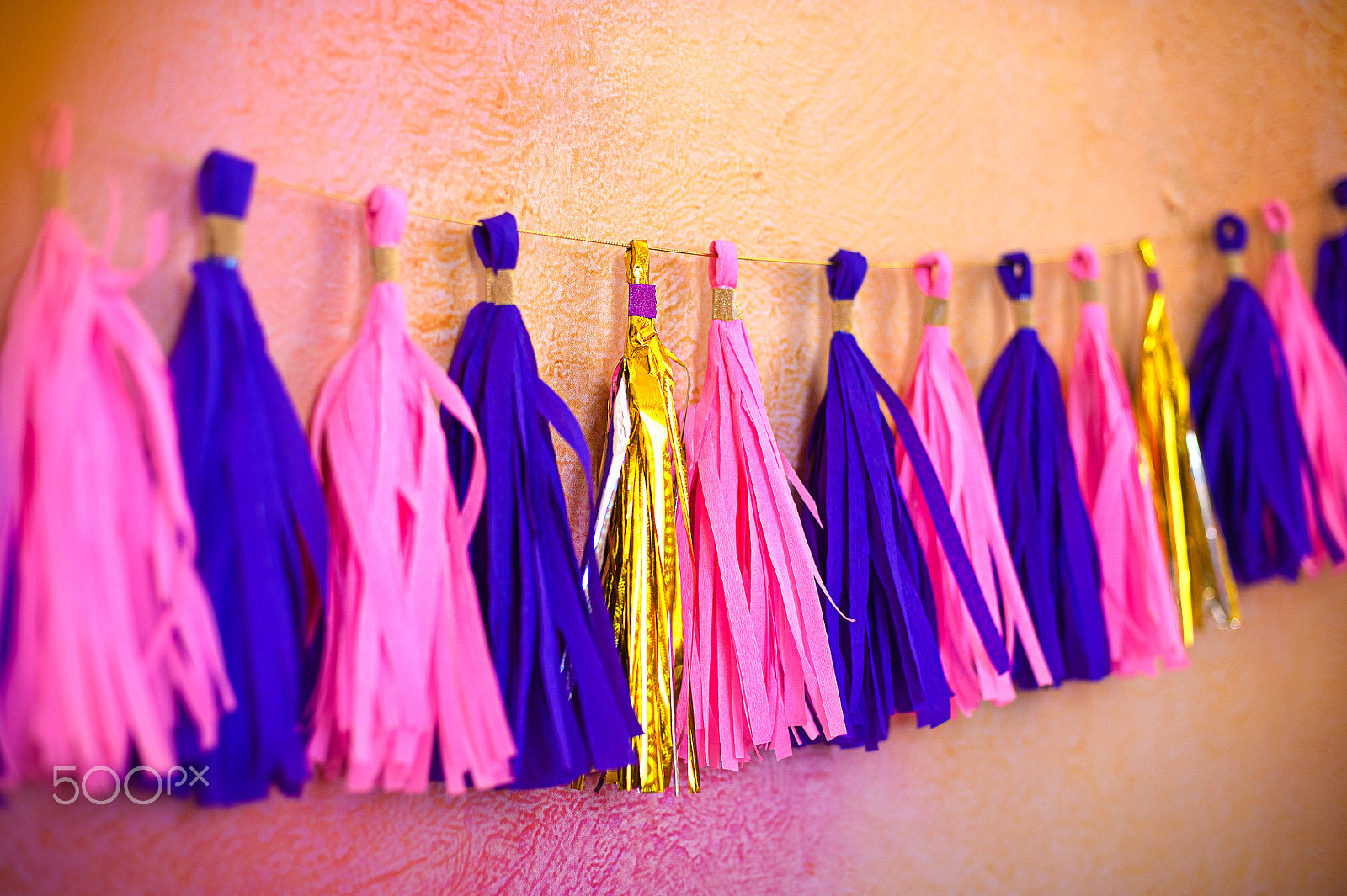 Nikon D700 + Nikon AF Nikkor 50mm F1.4D sample photo. Colored tassel garland. decoration for birthday. concept carnival photography