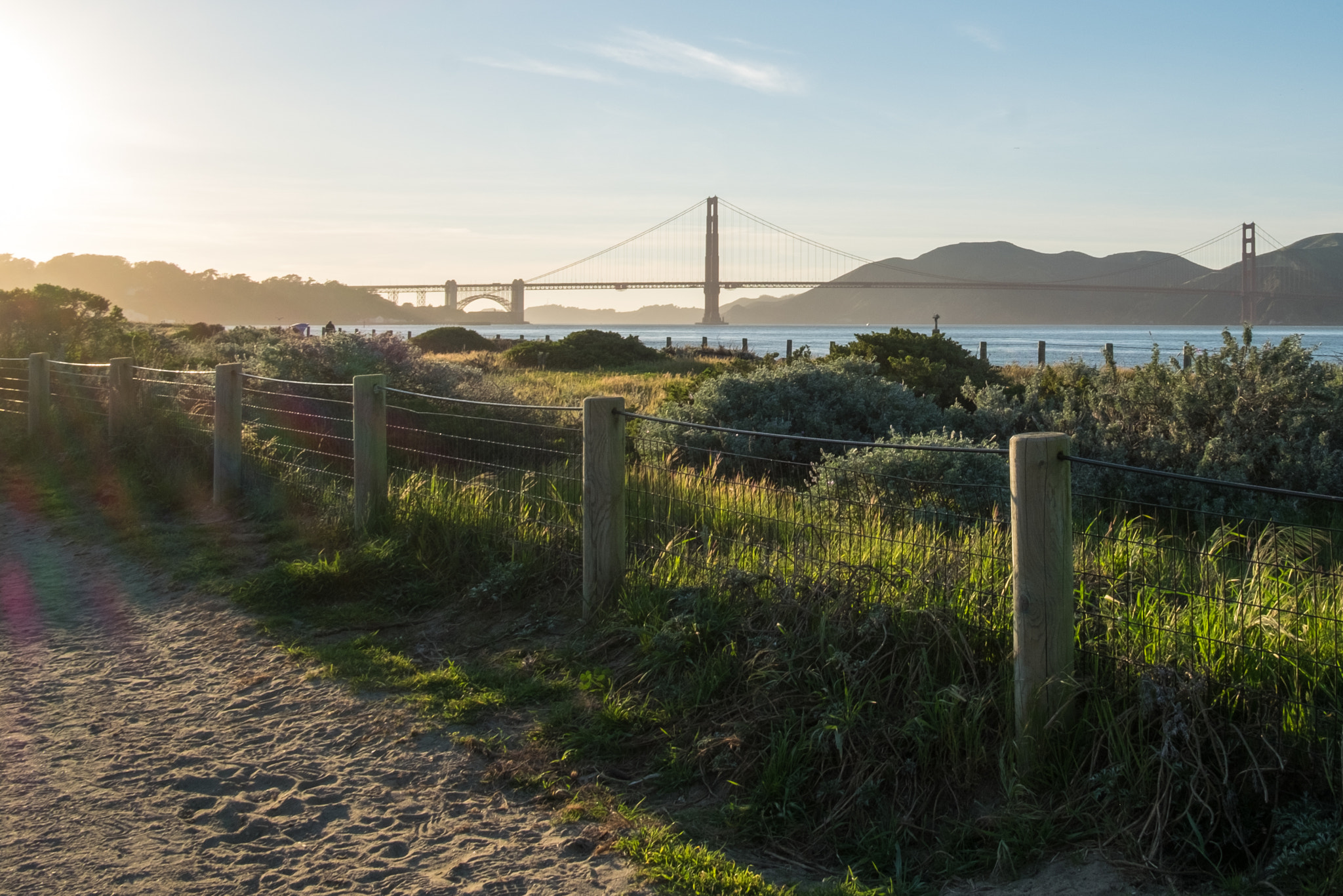 Fujifilm X-T10 + Fujifilm XF 18mm F2 R sample photo. The fence and the bridge photography