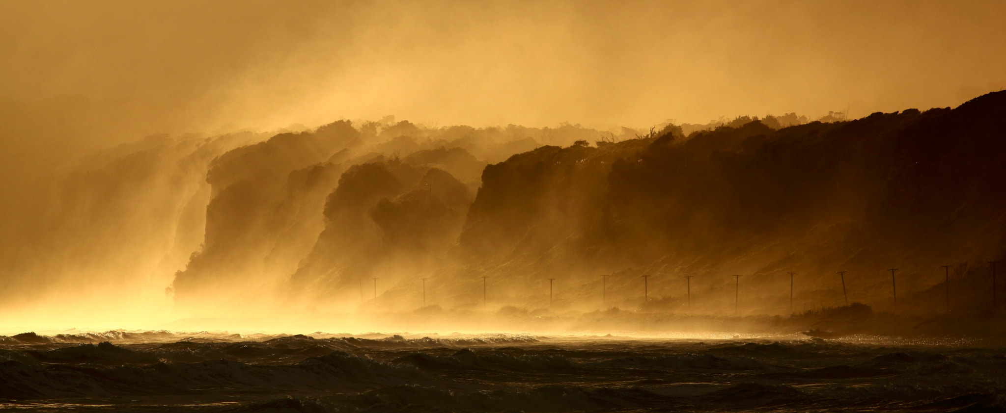 Canon EF 400mm F5.6L USM sample photo. Te wae wae cliffs at sunset photography
