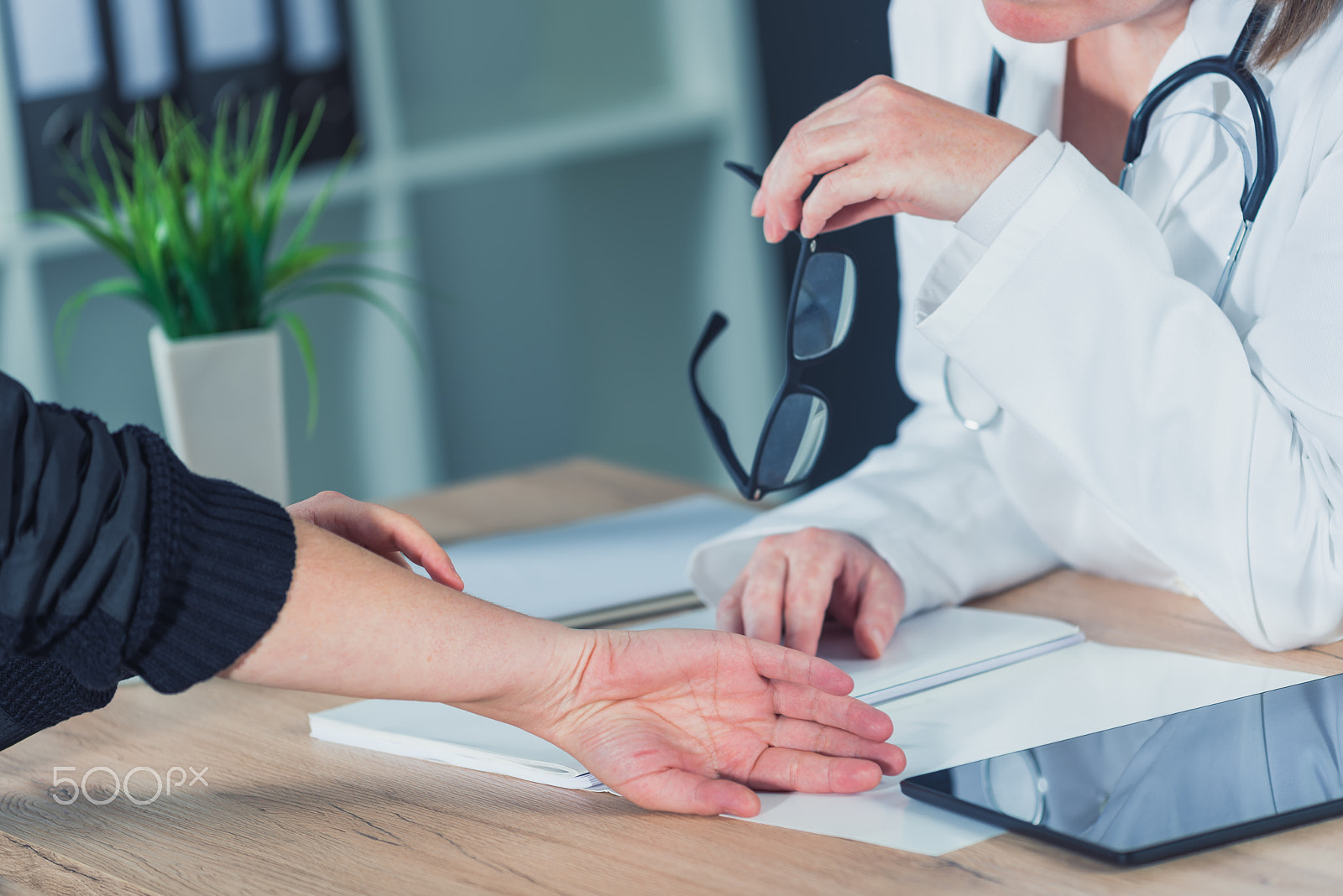 Nikon D810 sample photo. Female patient at orthopedic doctor medical exam for wrist injur photography