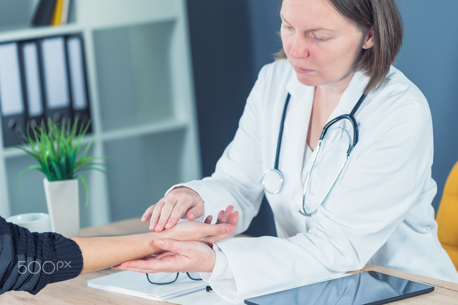 Nikon D810 sample photo. Female patient at orthopedic doctor medical exam for wrist injur photography