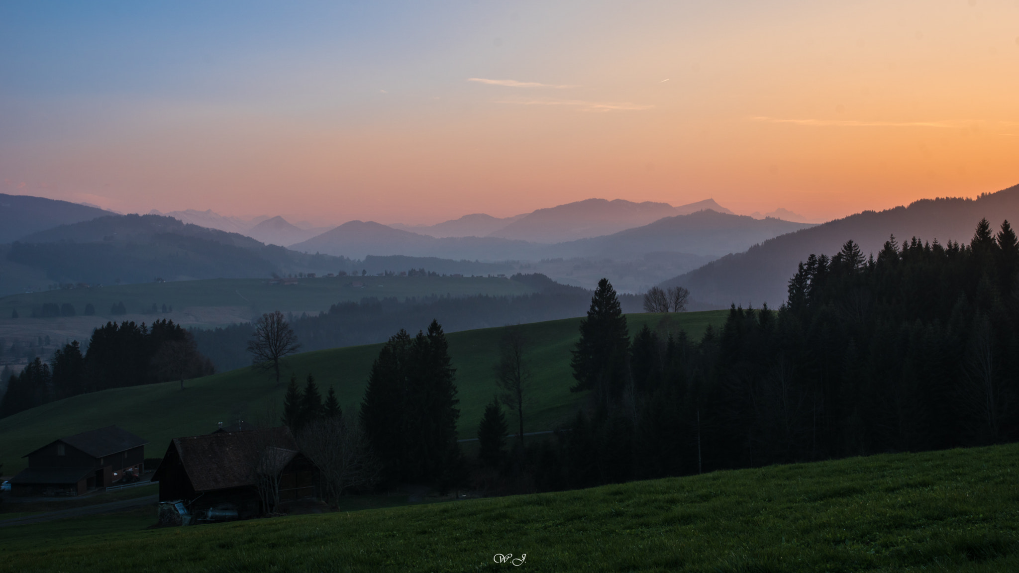 Sony ILCA-77M2 sample photo. Hilly countryside at dusk photography