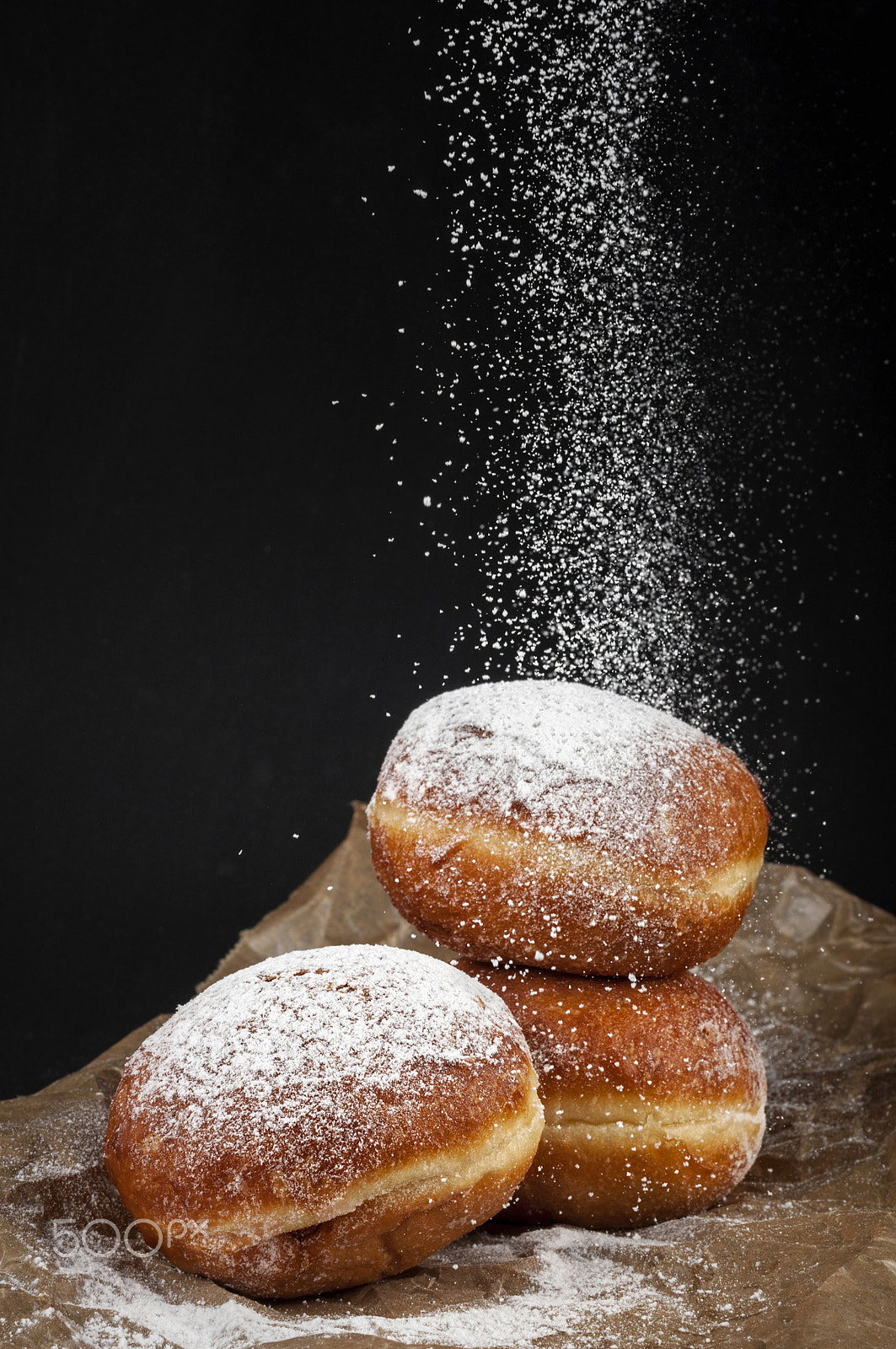 Nikon D5000 + Nikon AF-S Nikkor 50mm F1.4G sample photo. Jelly filled powdered doughnuts on a dark background photography