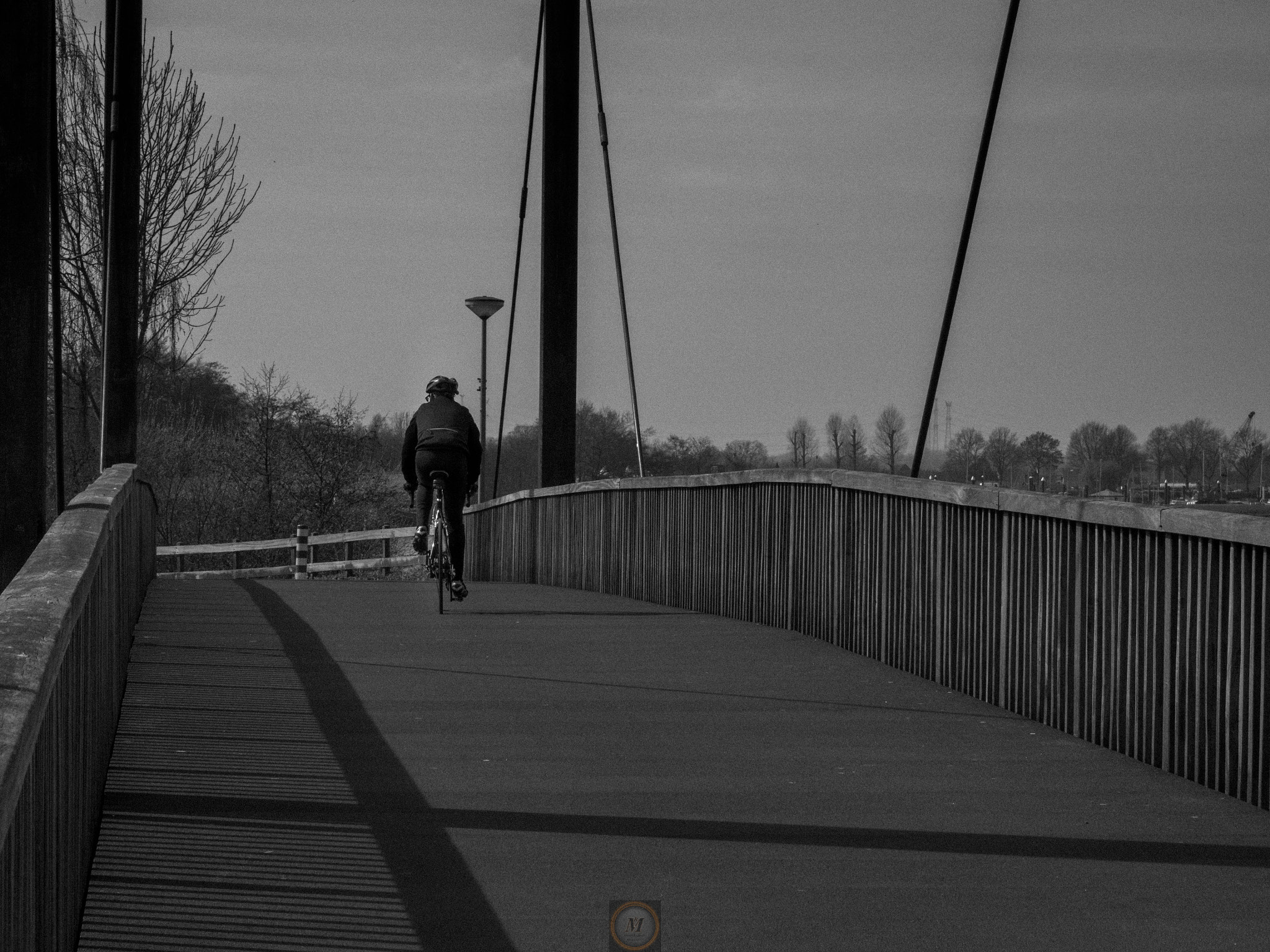 Olympus OM-D E-M5 II sample photo. The lonely biker photography