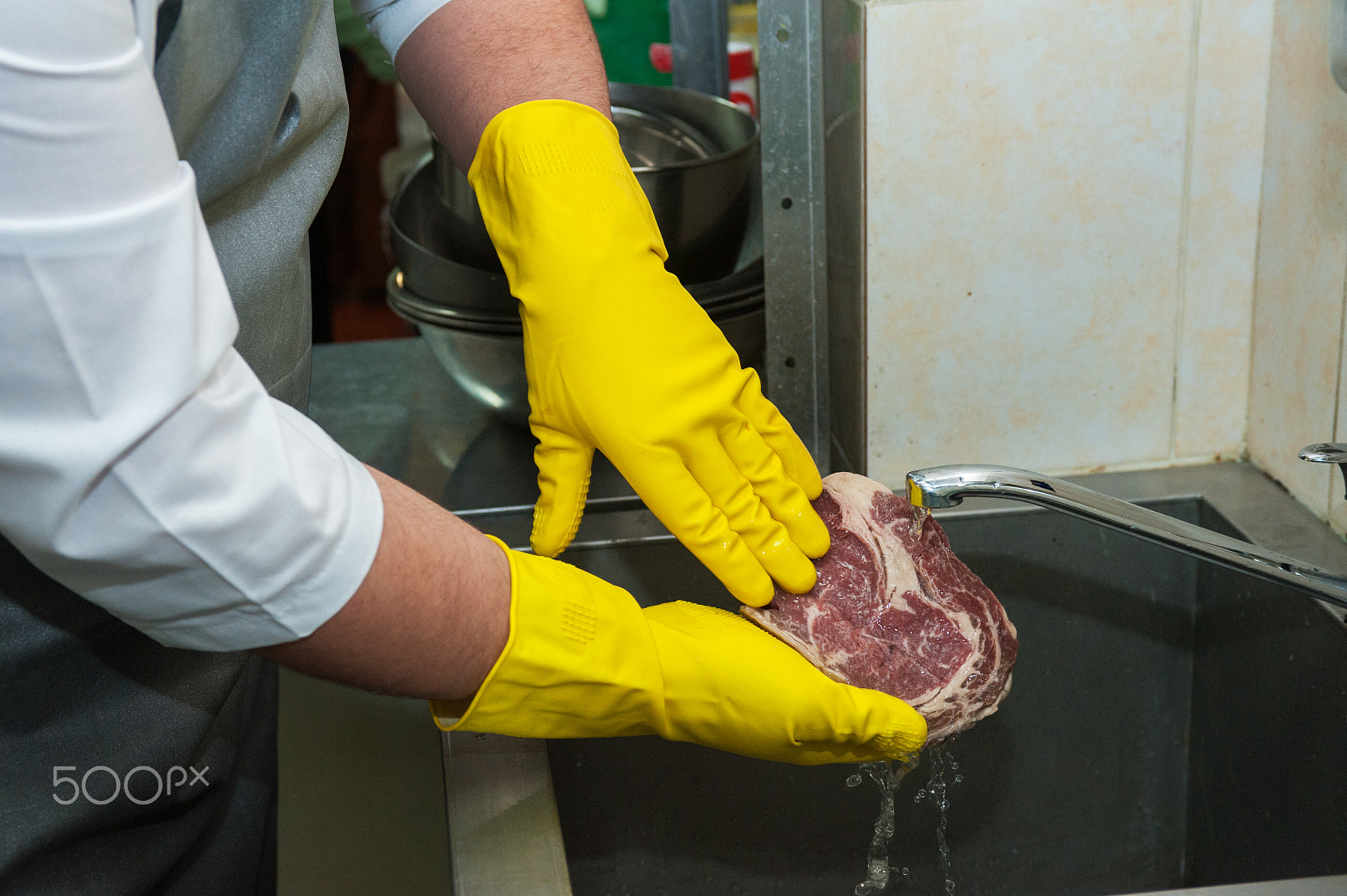Nikon D700 sample photo. Washing and cleaning meat photography
