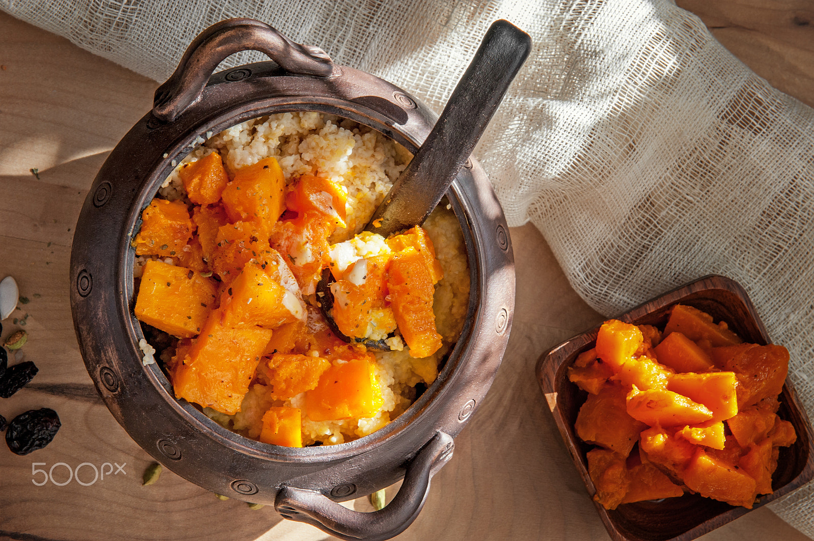 Nikon AF-S Nikkor 24-70mm F2.8G ED sample photo. Vegetarian wheat porridge with large chunks of roasted pumpkin in a clay pot in a rustic style... photography