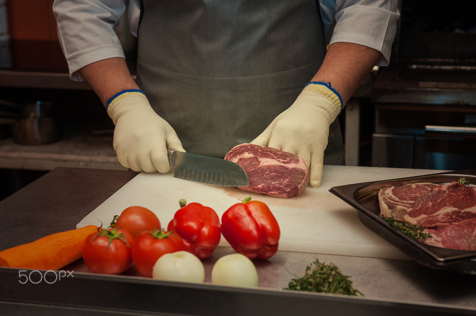 Nikon D700 sample photo. Chef cutting meat photography