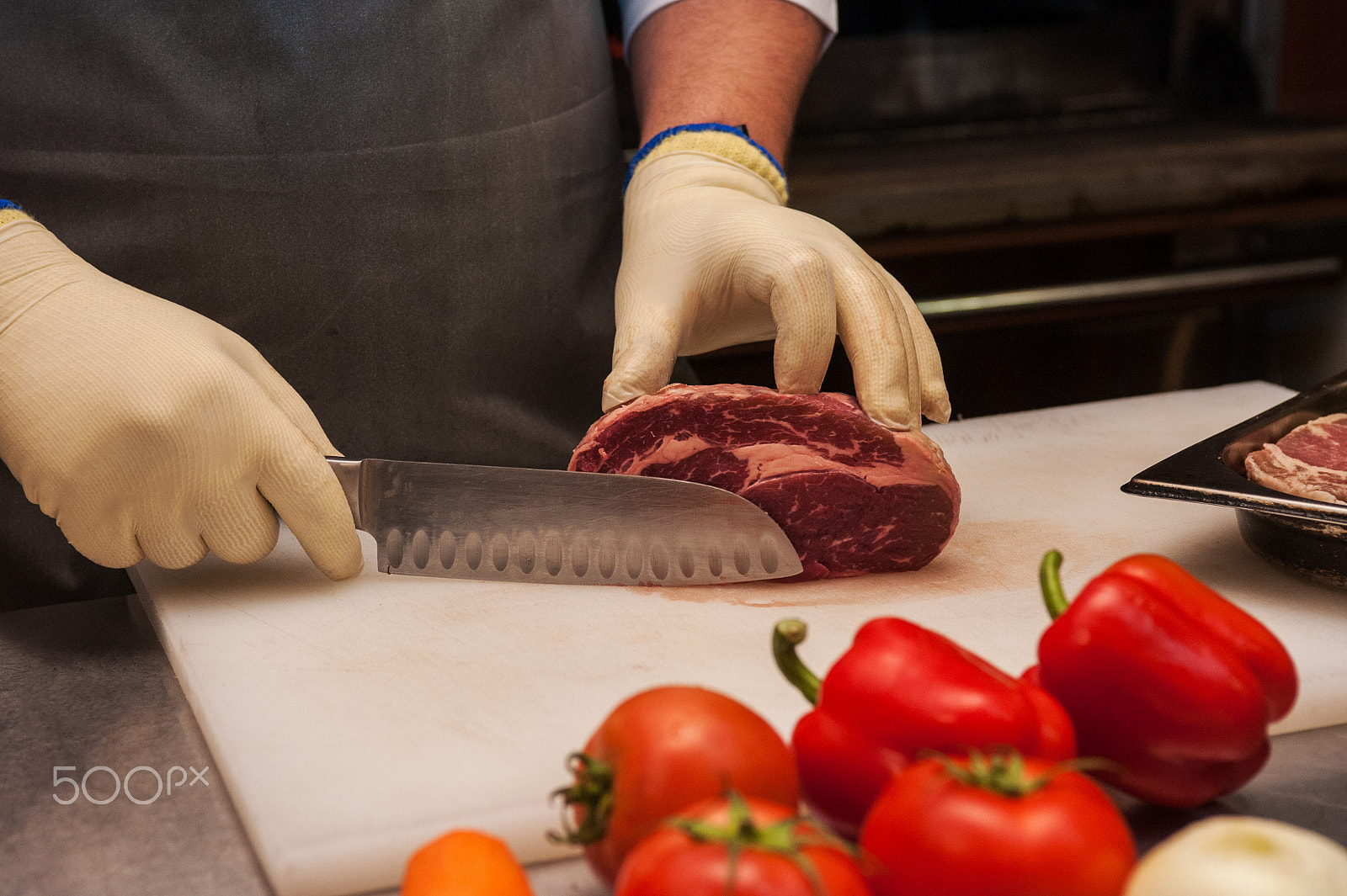 Nikon D700 sample photo. Chef cutting meat photography