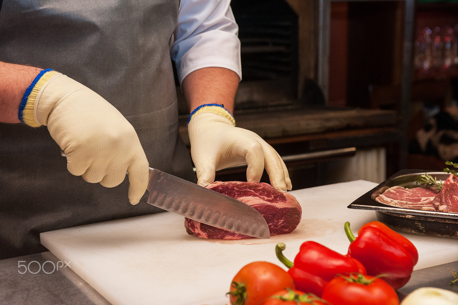 Nikon AF-S Nikkor 28-70mm F2.8 ED-IF sample photo. Chef cutting meat photography