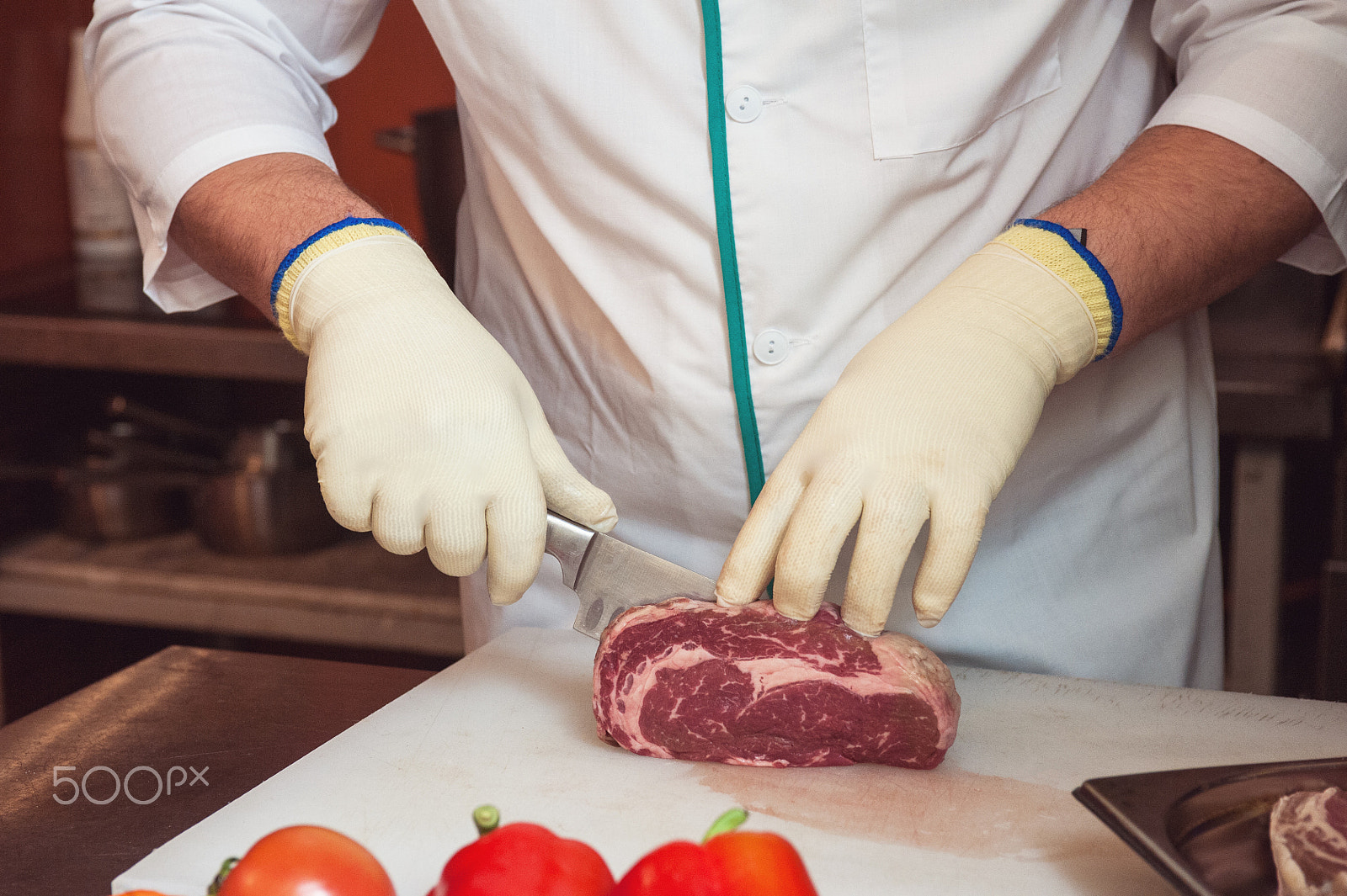 Nikon D700 sample photo. Chef cutting meat photography