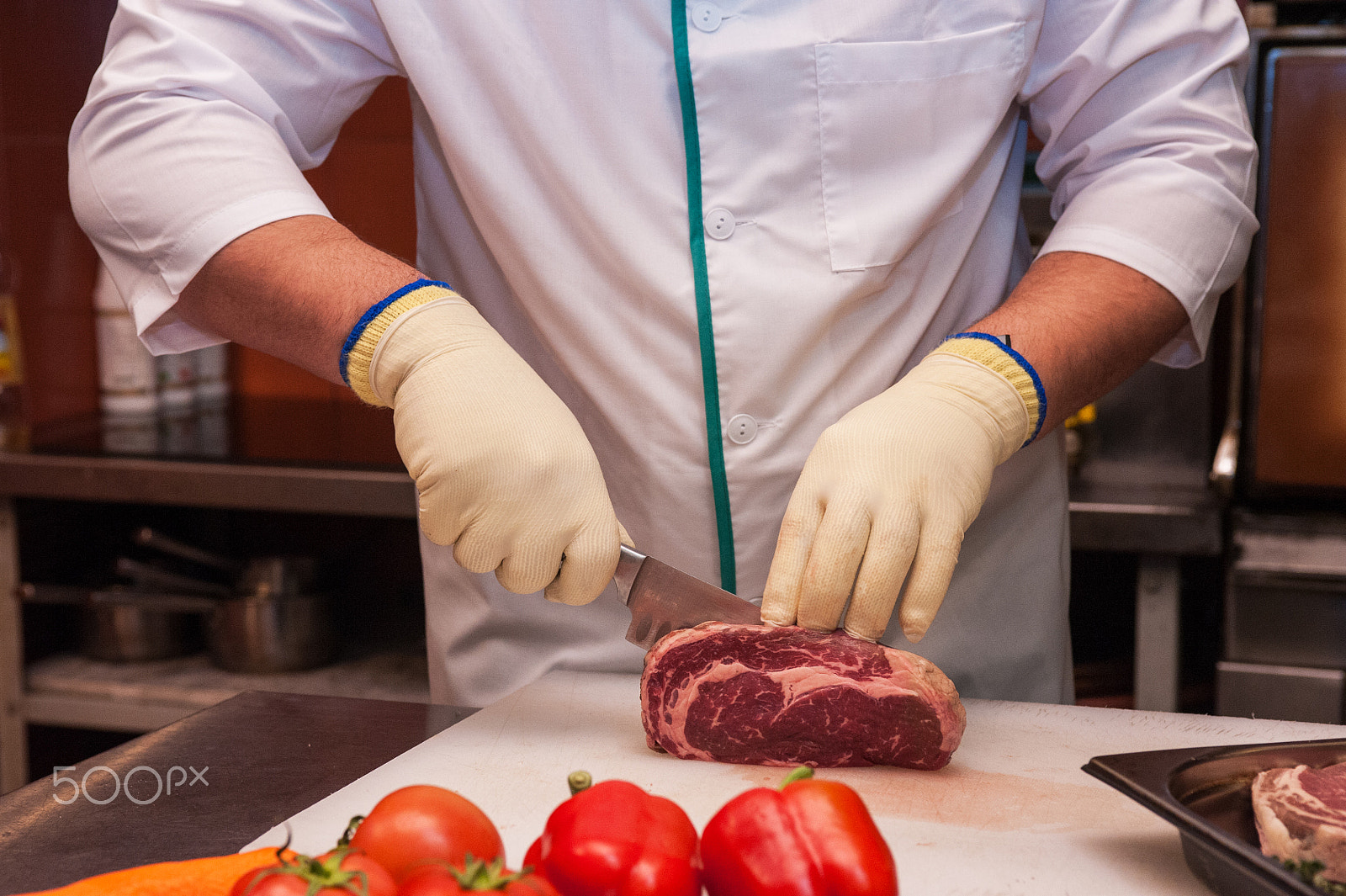 Nikon D700 sample photo. Chef cutting meat photography