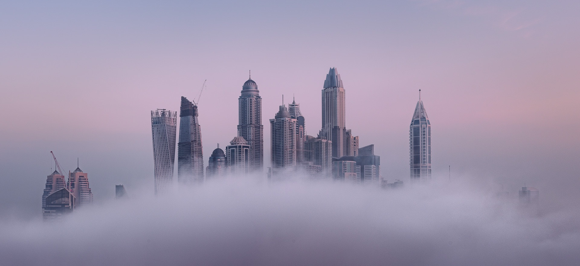 Nikon D810 + Nikon PC-E Nikkor 45mm F2.8D ED Tilt-Shift sample photo. Skyscrapers of the dubai marina in fog. photography