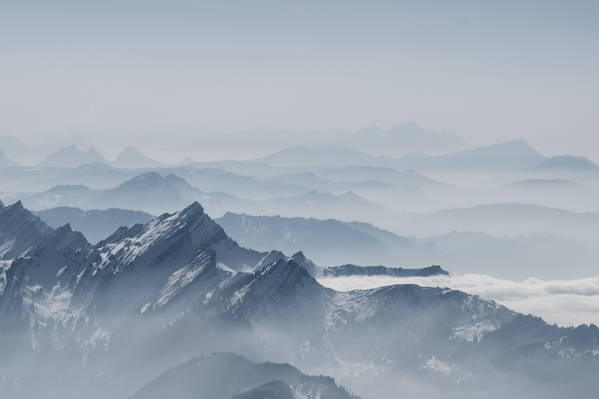 Sony ILCA-77M2 + Sigma 70-300mm F4-5.6 DL Macro sample photo. Foggy swiss alps photography