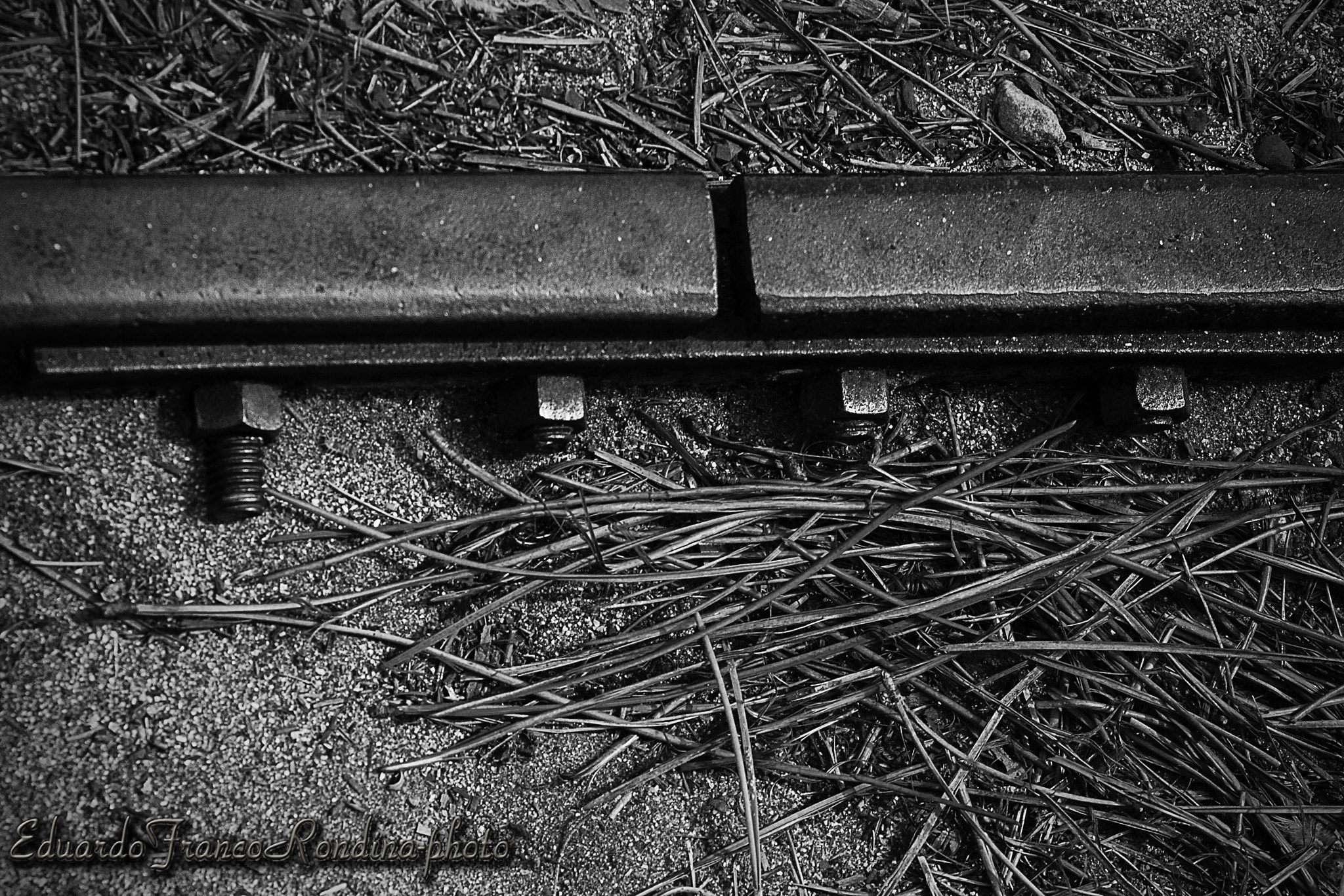 Canon EOS 400D (EOS Digital Rebel XTi / EOS Kiss Digital X) sample photo. Four bolts and a piece of track photography