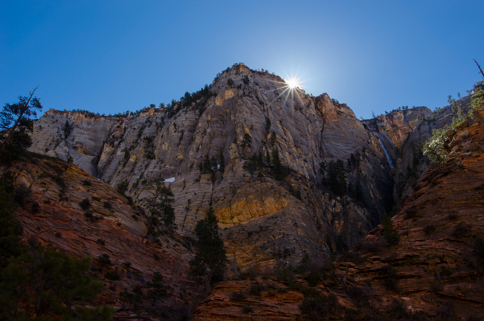 Nikon D5100 + Nikon AF-S Nikkor 20mm F1.8G ED sample photo. Zion-peeking sun photography