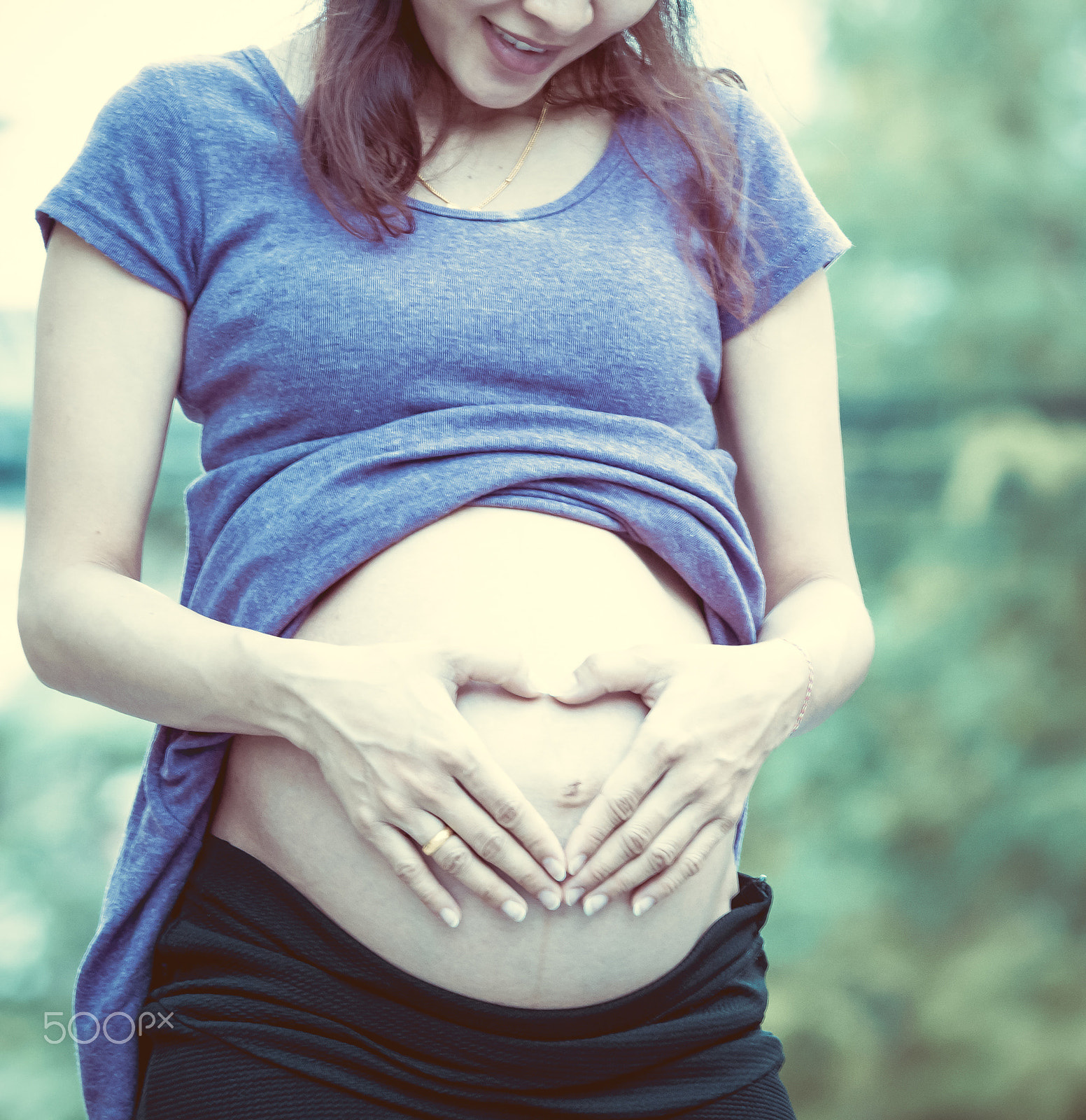 Canon EOS 7D sample photo. Pregnant woman touching her belly with hands shaped heart photography
