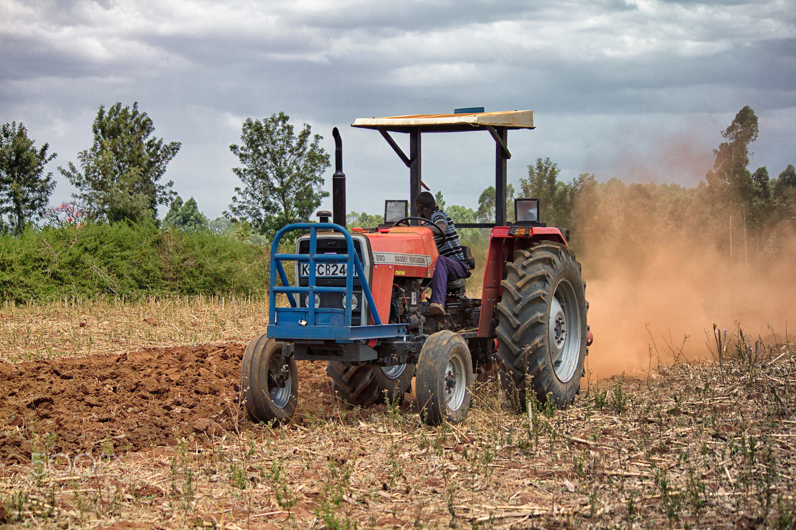 Canon EF-S 55-250mm F4-5.6 IS II sample photo. Tractor ploughing photography
