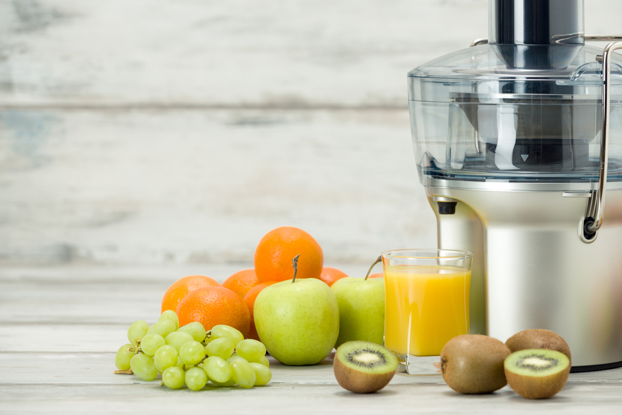 Nikon D810 sample photo. Modern electric juicer, various fruit and glass of freshly made juice, healthy lifestyle concept photography